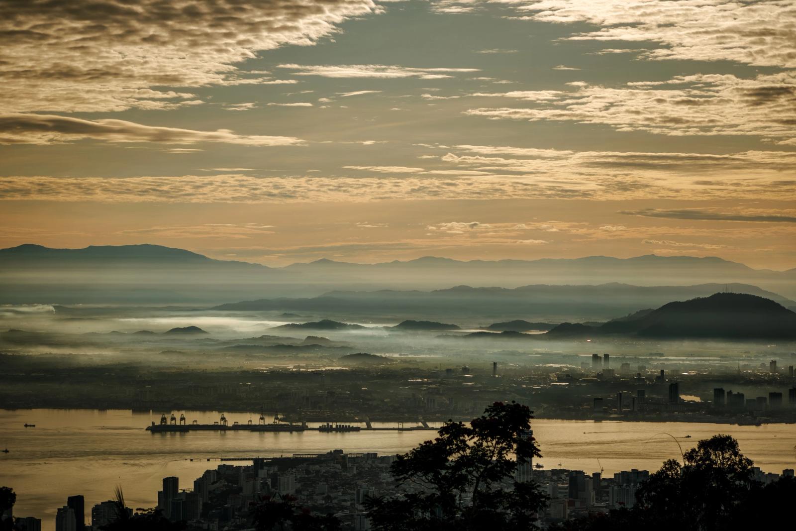 Capture of a serene golden sunrise over Penang city from Bukit Bendera, Malaysia