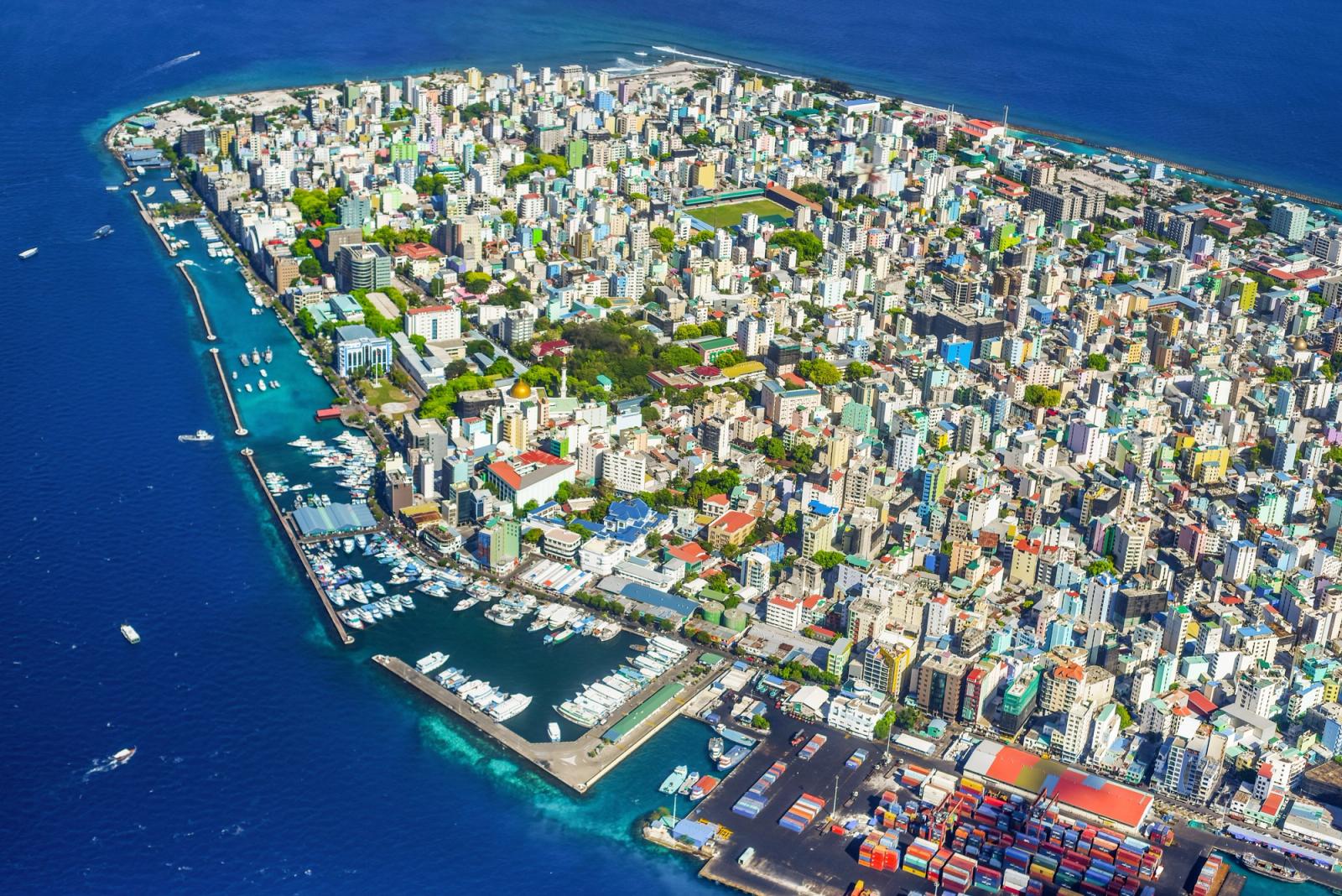 Stunning aerial shot of Malé, Maldives, showcasing colorful buildings and a vibrant coastline