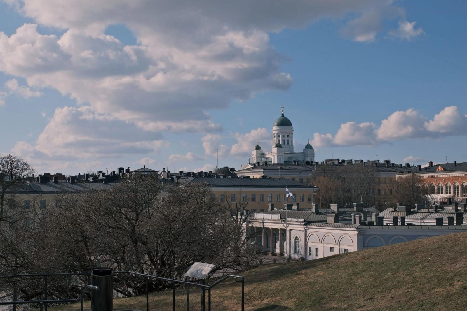 View of Helsinki Cathedral under a scenic cloudy sky, capturing the city's classic architecture