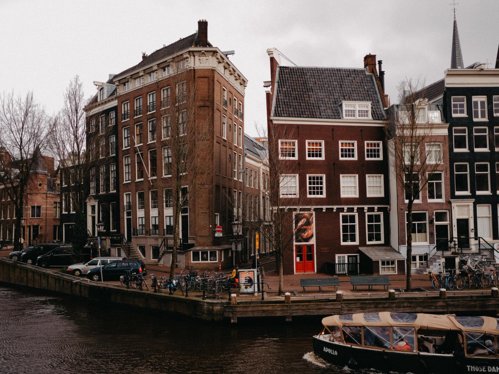 Explore the classic canals and distinctive architecture of Amsterdam on a cloudy day