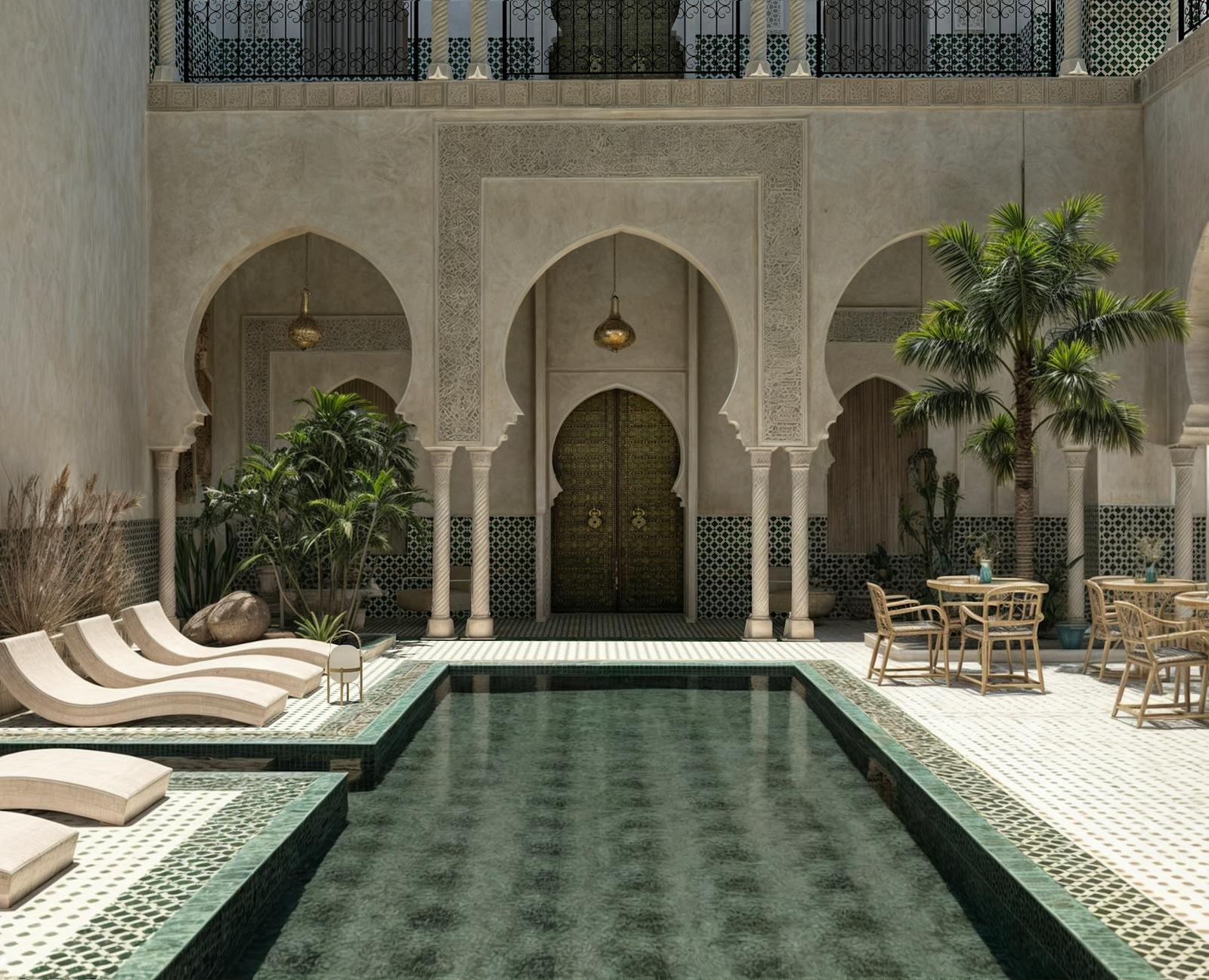 A tiled courtyard pool framed by horseshoe arches and lounge chairs