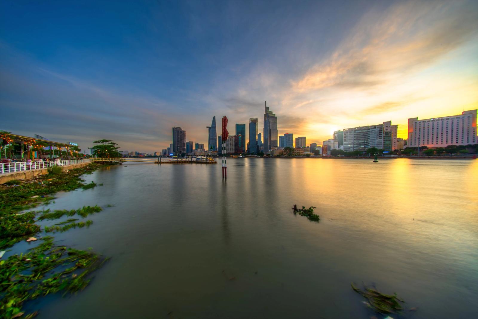 Beautiful sunset view of the Saigon River with Ho Chi Minh City skyline in Vietnam