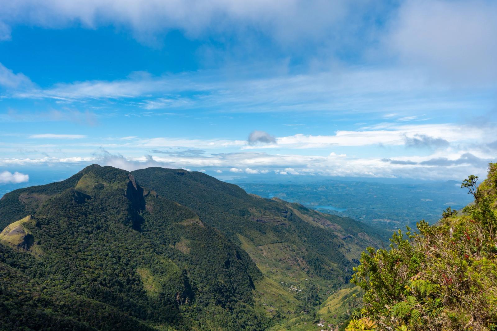 A stunning view of the lush mountainous landscape in Central Province, Sri Lanka, under a clear blue sky