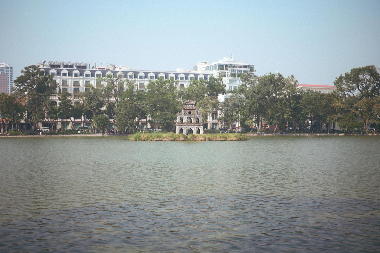 Scenic view of Hoan Kiem Lake with Turtle Tower, Hanoi, Vietnam