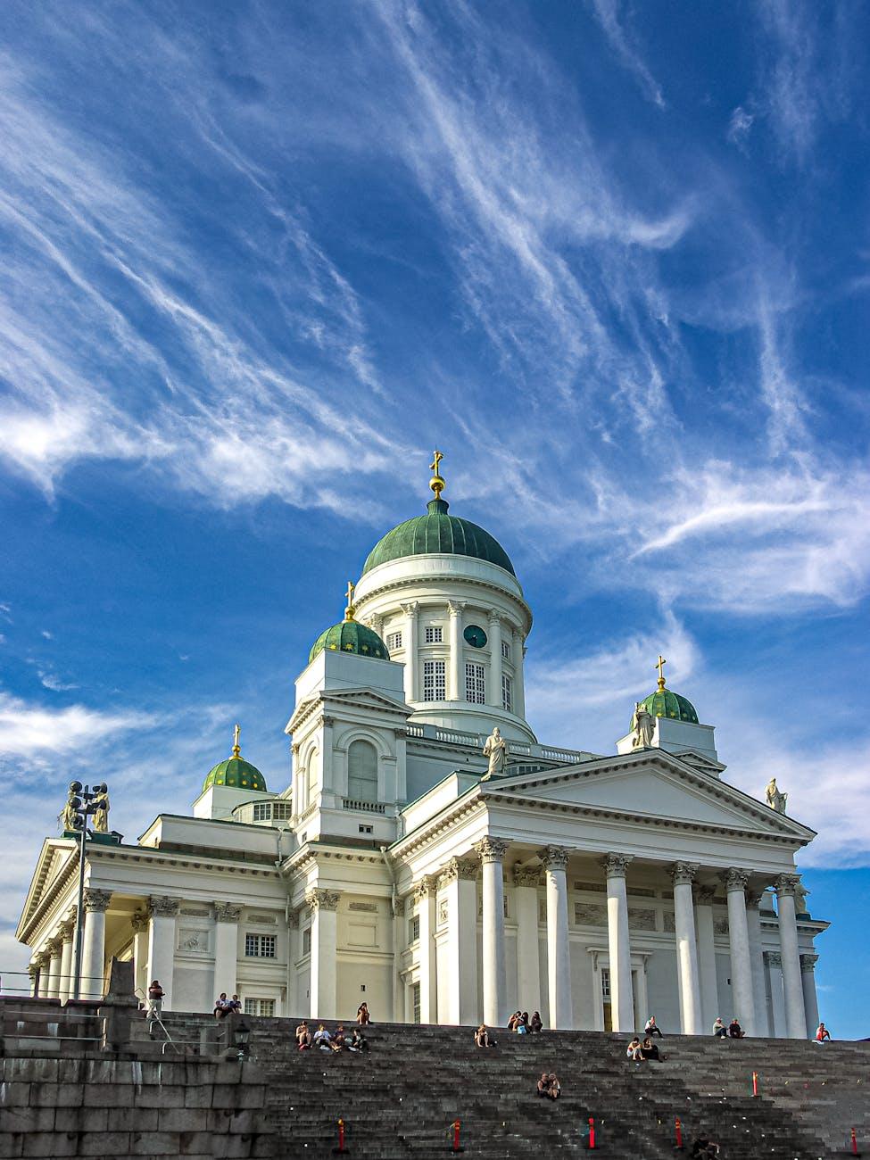 Low angle view of Helsinki Cathedral under a vivid blue sky