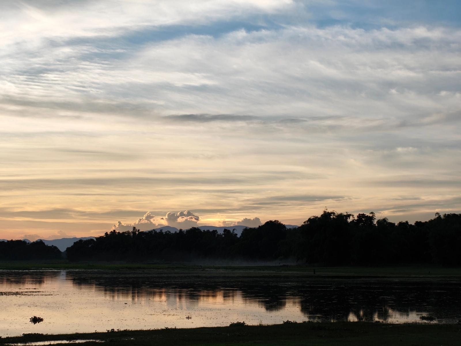 A captivating sunset view with water reflections in Silchar, India, showcasing beautiful natural scenery