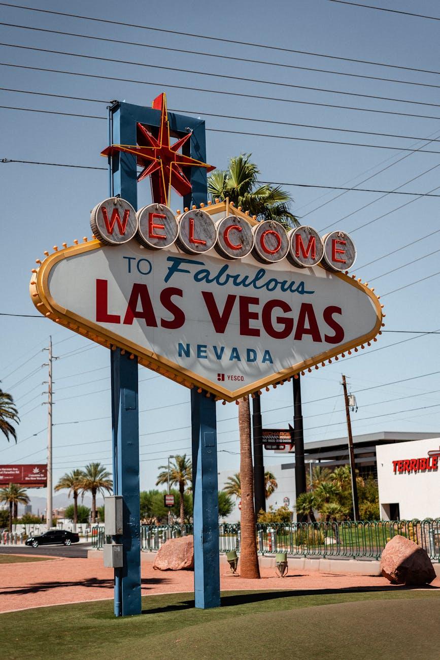 Welcome to Las Vegas sign beside a passing car