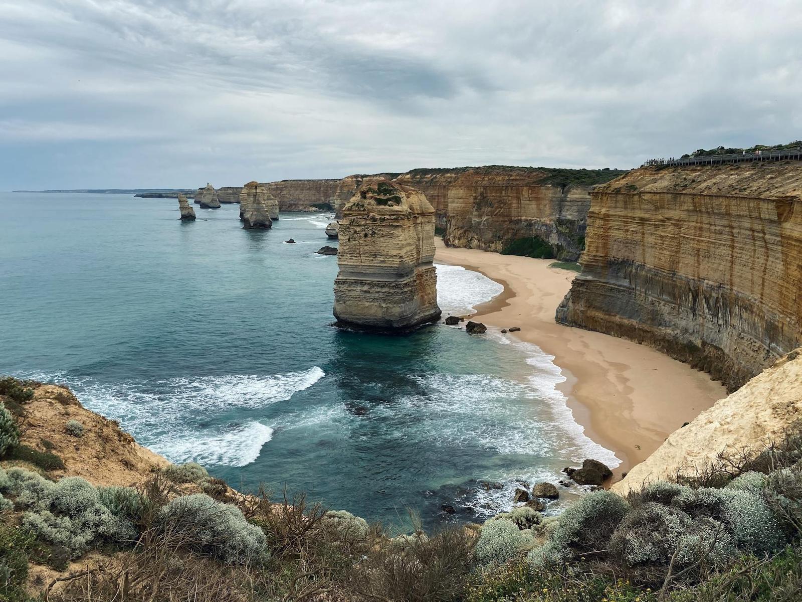 Stunning view of the Twelve Apostles with towering cliffs and waves crashing on the shore