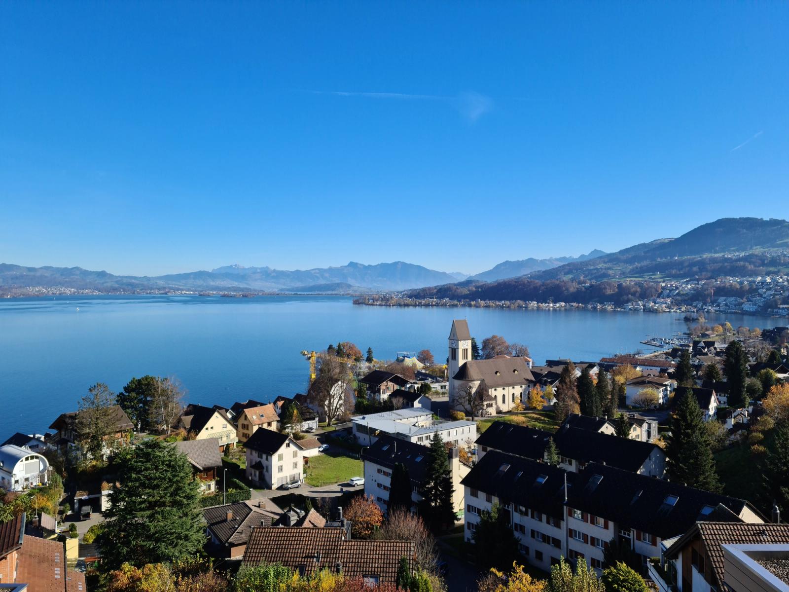Stunning aerial view of Richterswil with Lake Zurich and mountains in the distance
