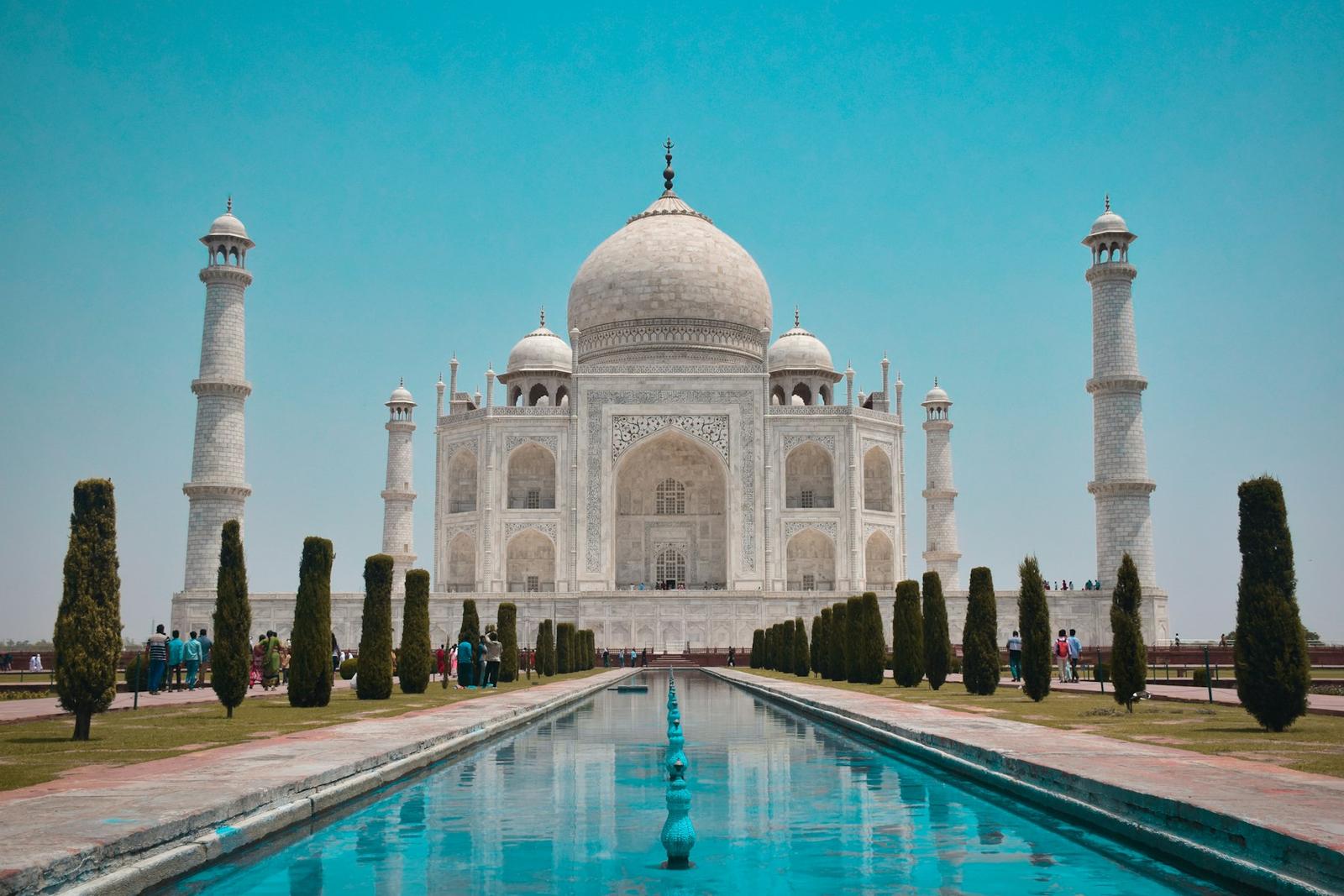 The Taj Mahal reflected in its watercourse at dawn