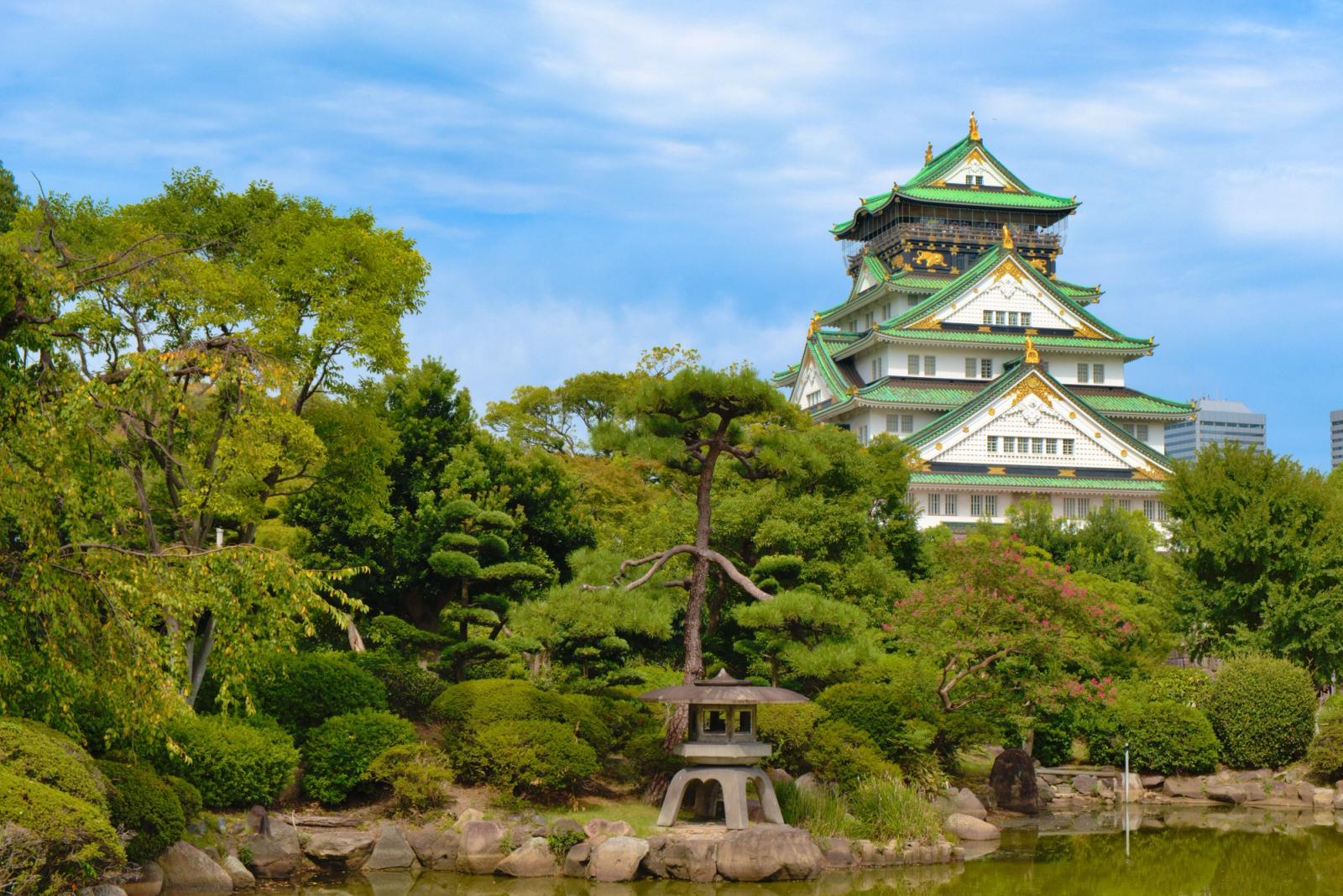 Discover the beauty of Osaka Castle surrounded by lush greenery in Osaka, Japan