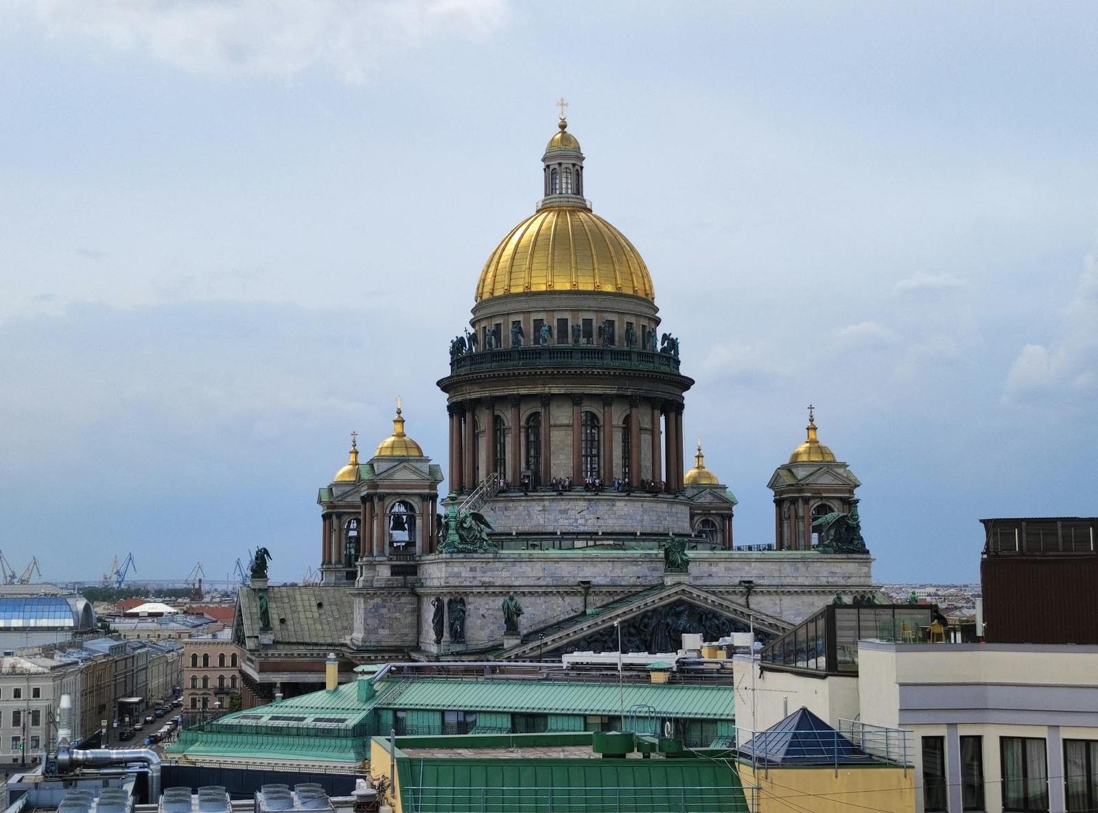 Grand golden-domed cathedral rising above a city skyline