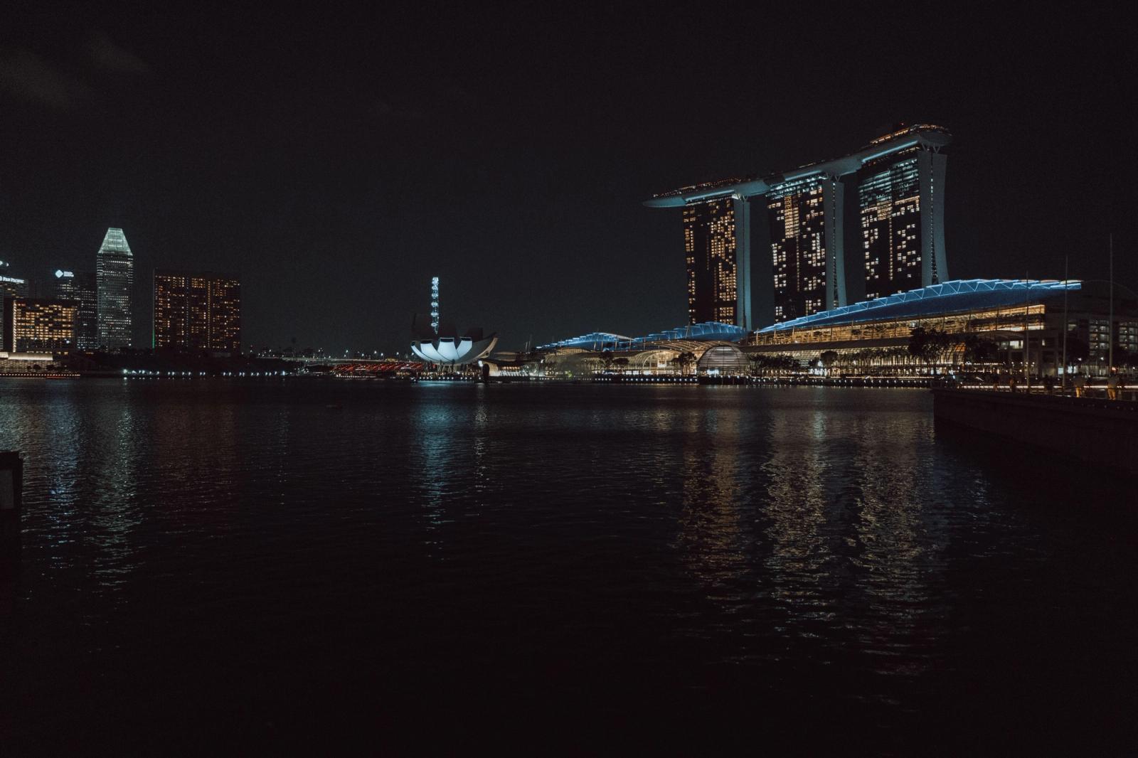 Captivating night view of Singapore skyline featuring Marina Bay Sands and cityscape reflections