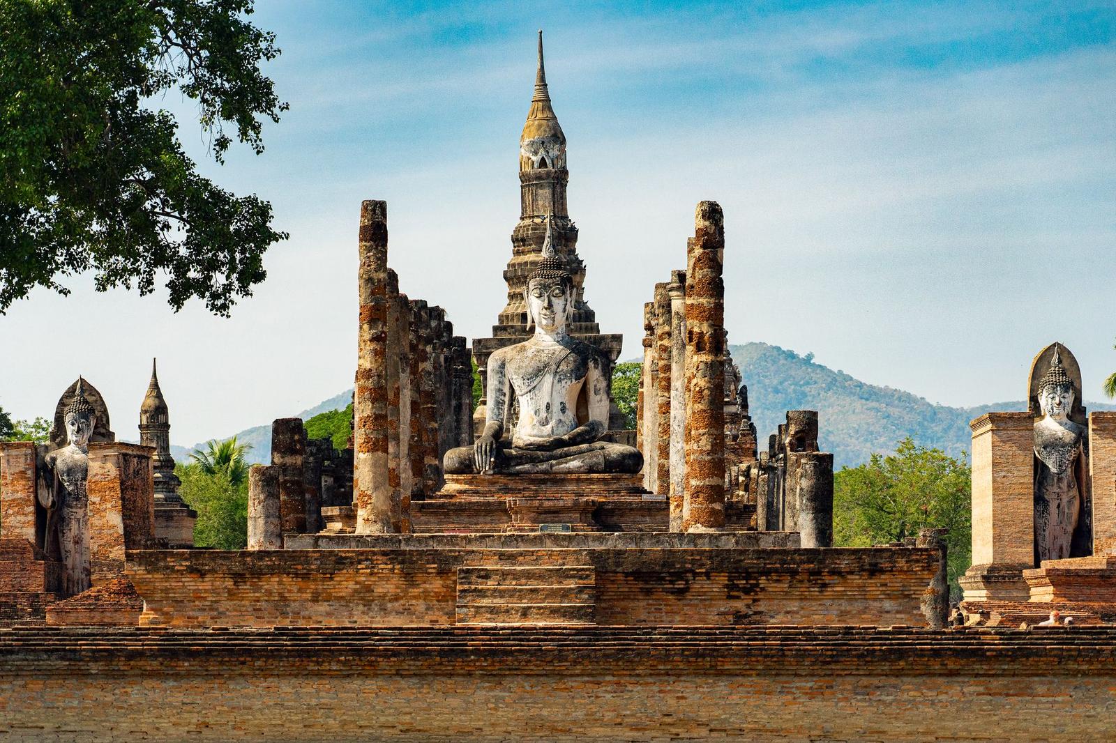 Explore the ancient ruins of Wat Mahathat temple in Sukhothai, a UNESCO World Heritage site in Thailand
