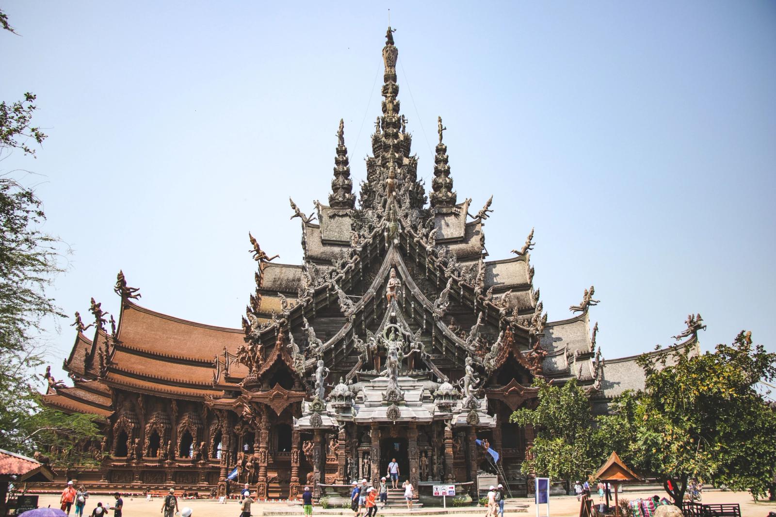 Majestic wooden temple showcasing intricate carvings and cultural architecture in Thailand