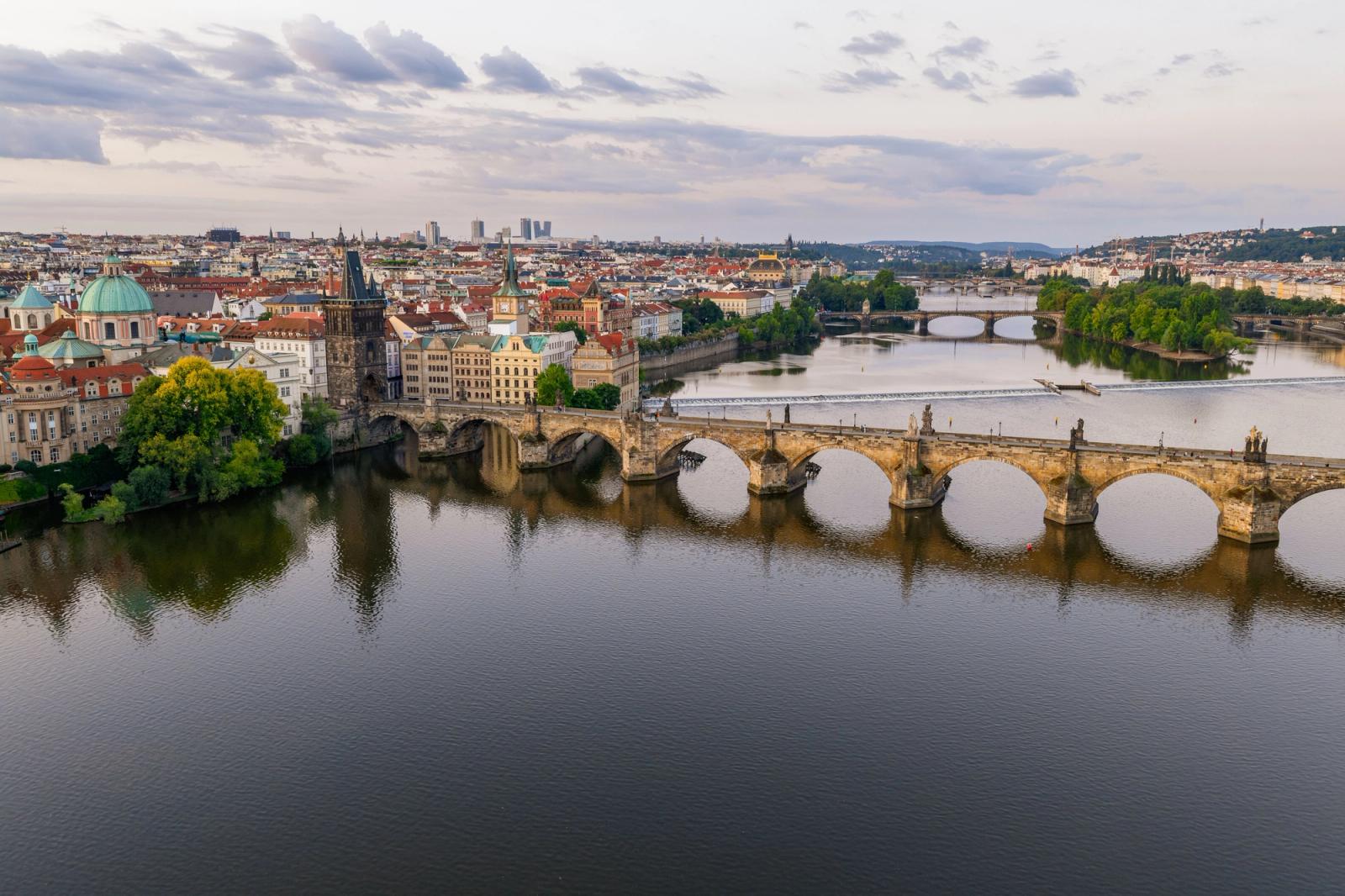 Stunning aerial shot of Charles Bridge over the Vltava River in Prague, showcasing historical architecture