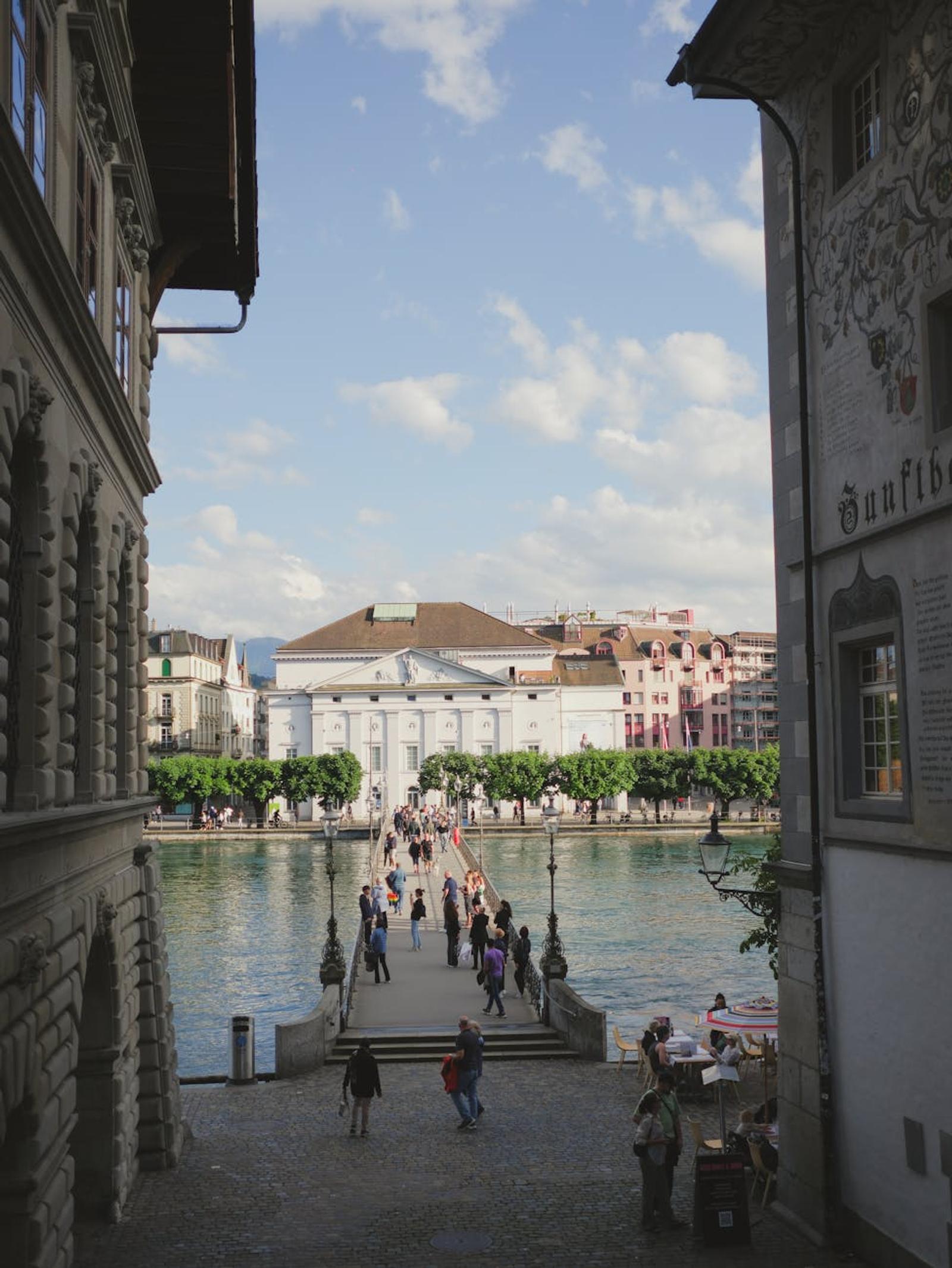 Explore the charming streets and canal bridges of Luzern, Switzerland with vibrant city life
