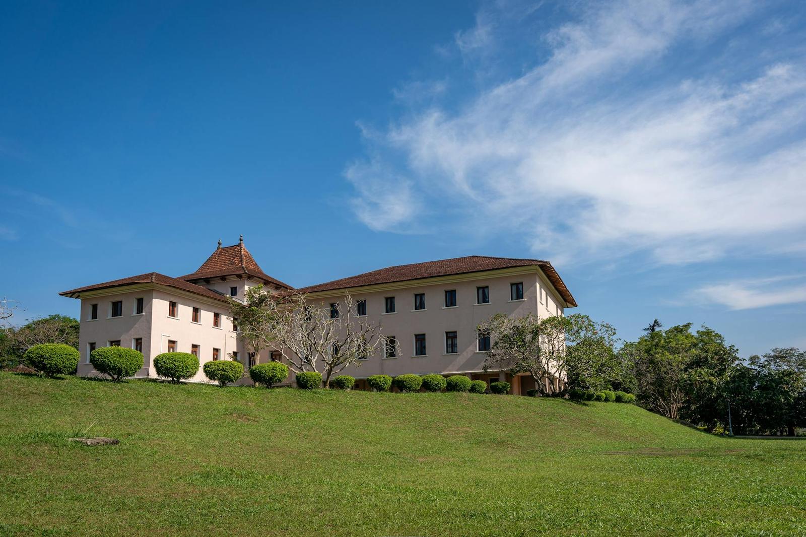 A scenic view of a historical building at the University of Peradeniya in Kandy