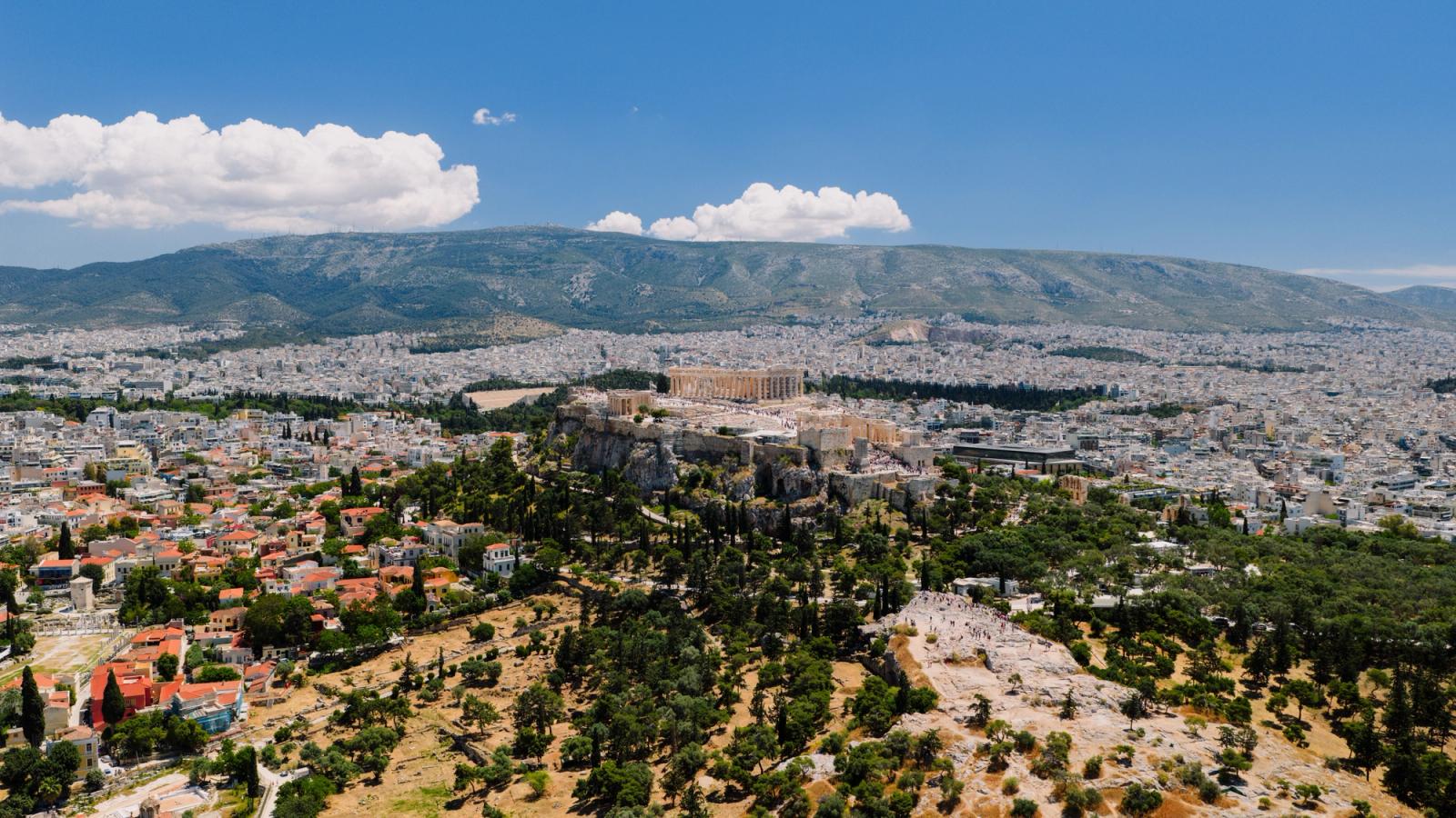 Stunning aerial view of the ancient Acropolis in Athens, Greece amidst the cityscape