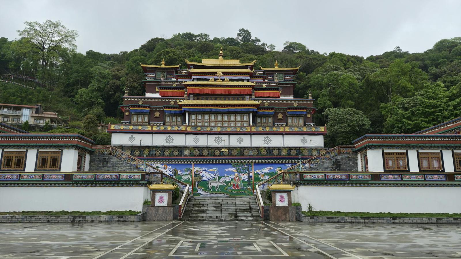 Front view of Rumtek Monastery surrounded by lush greenery in Sikkim, India