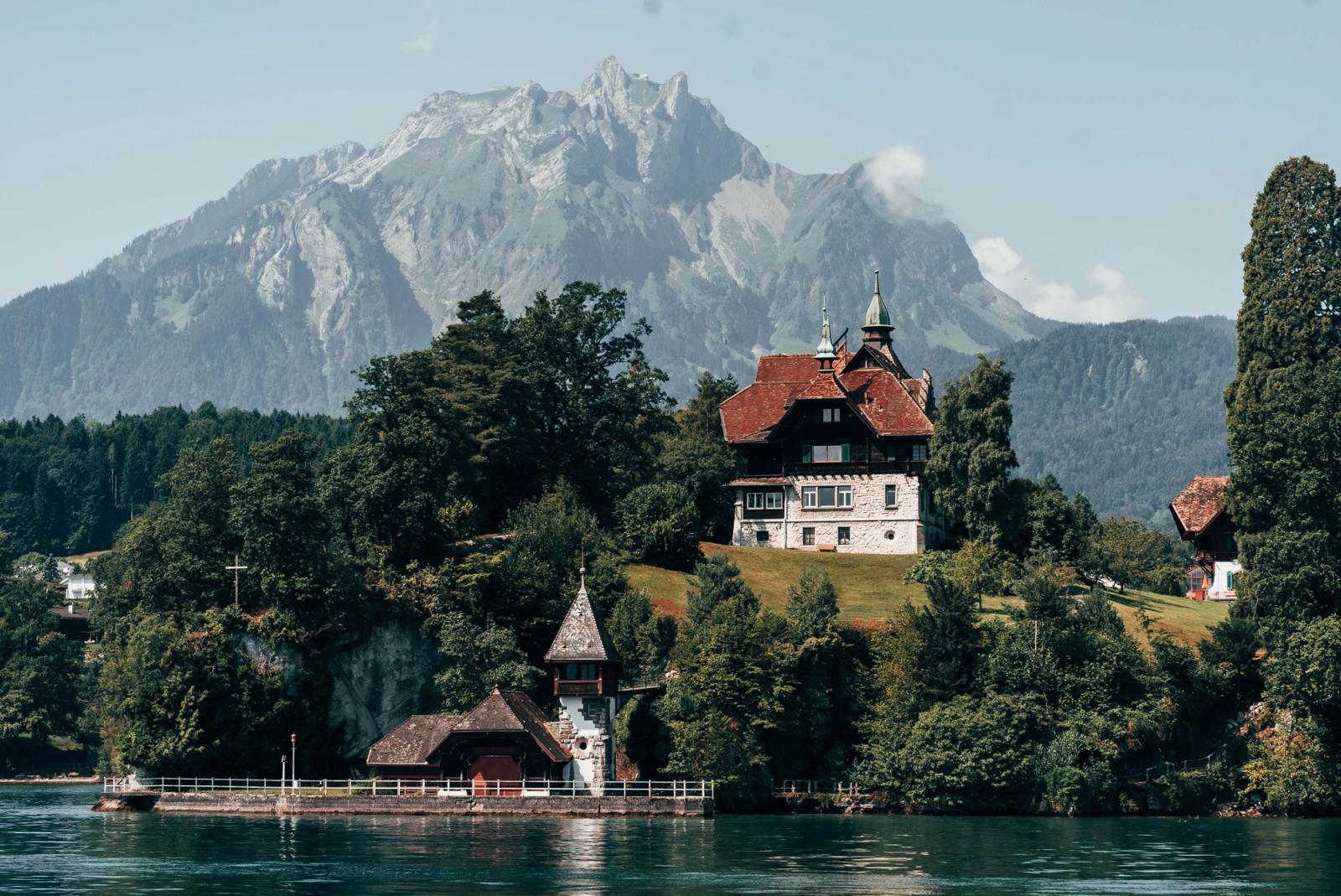 Charming villa by a lake in Lucerne, Switzerland, surrounded by mountains and trees