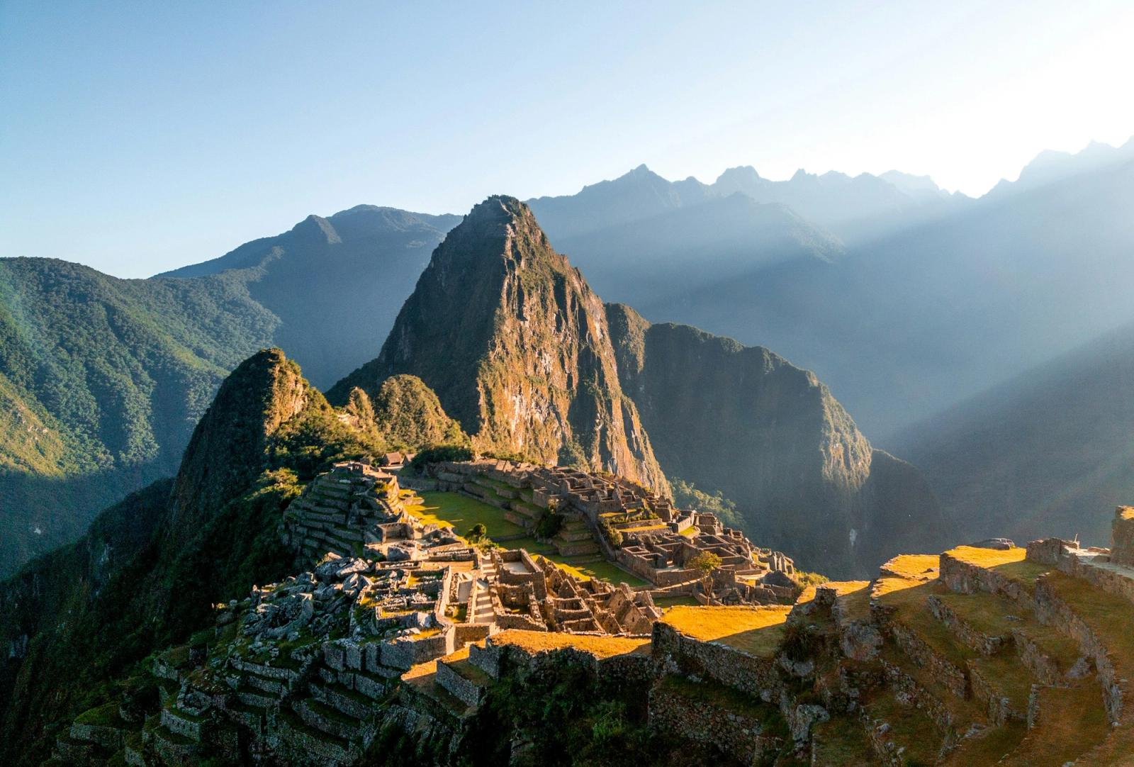 Ancient stone ruins on a mountain terrace at sunrise