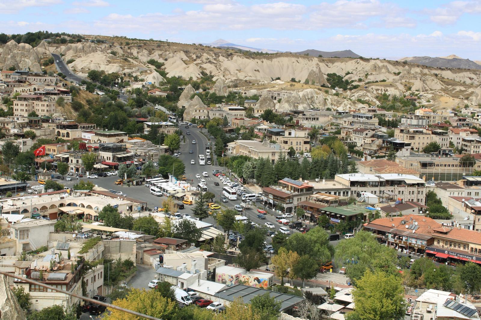 A panoramic view of Göreme, Turkey showcasing unique rock formations and traditional architecture