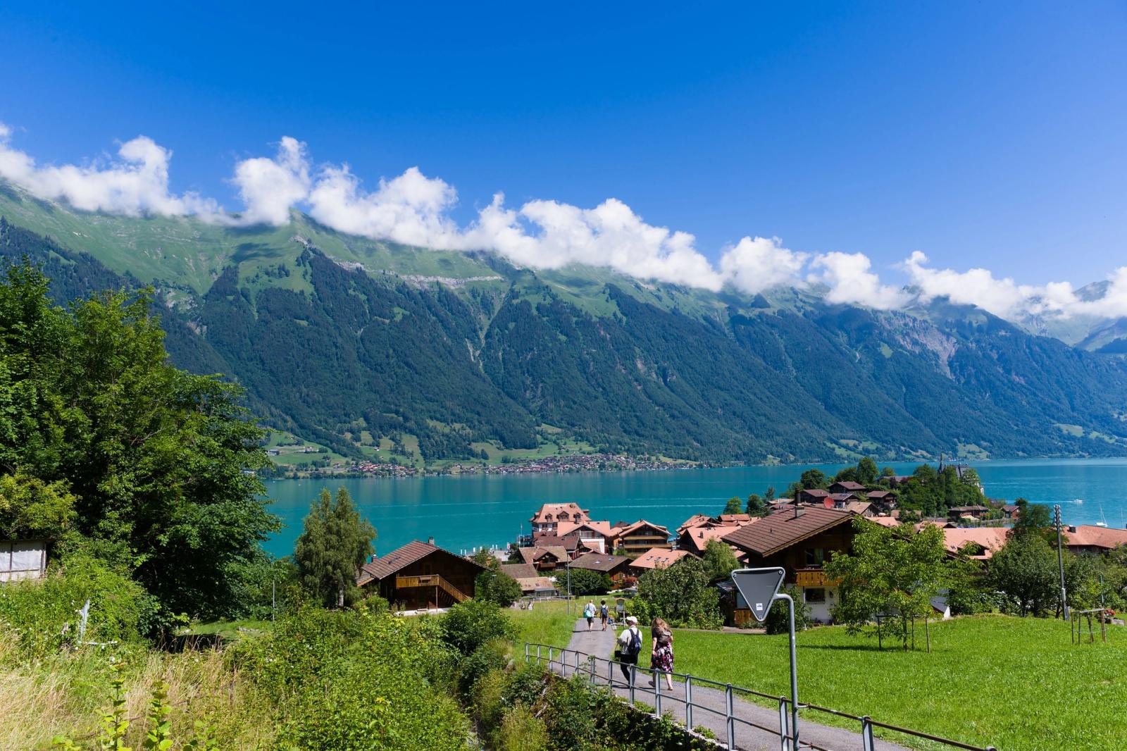 Scenic view of Iseltwald with lush mountains and Lake Brienz in Switzerland