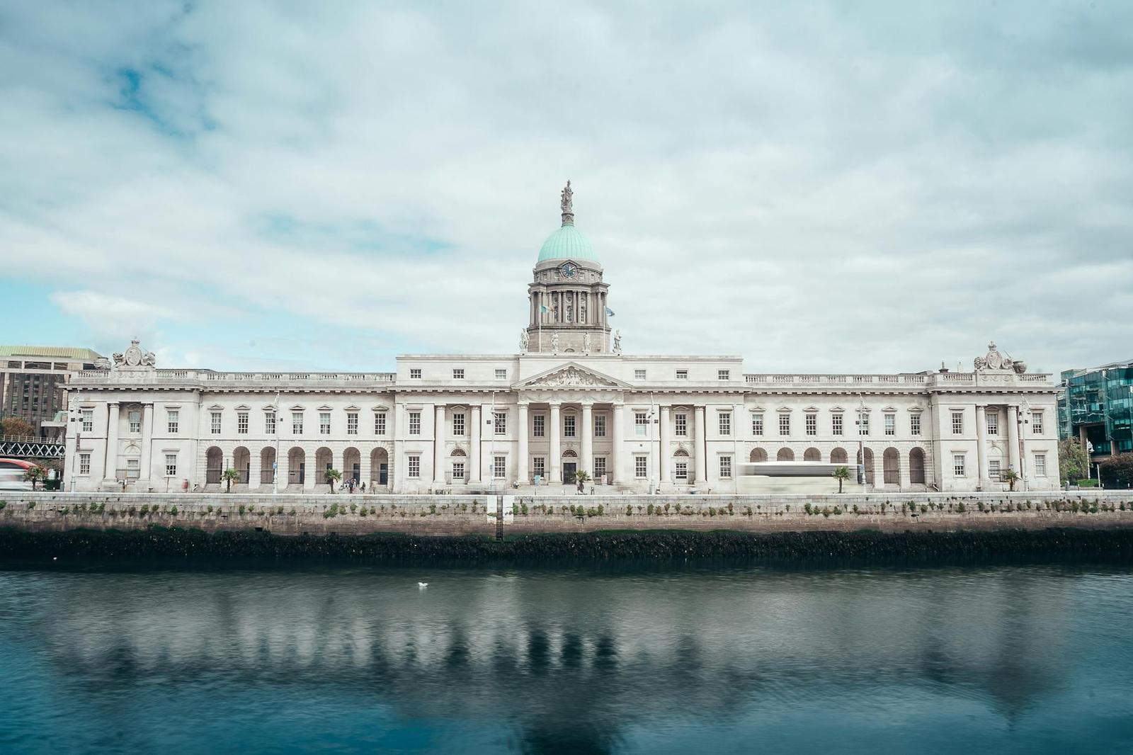 A scenic view of the historic Custom House reflecting in the River Liffey in Dublin, Ireland