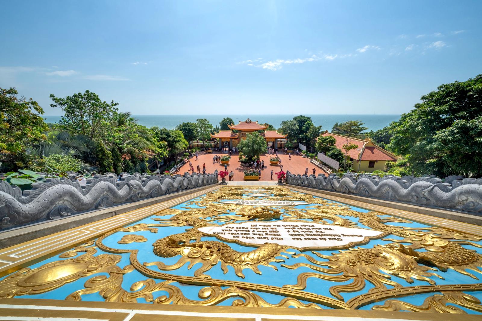 Breathtaking aerial of Ho Quoc Pagoda in Phu Quoc, surrounded by lush nature and sea