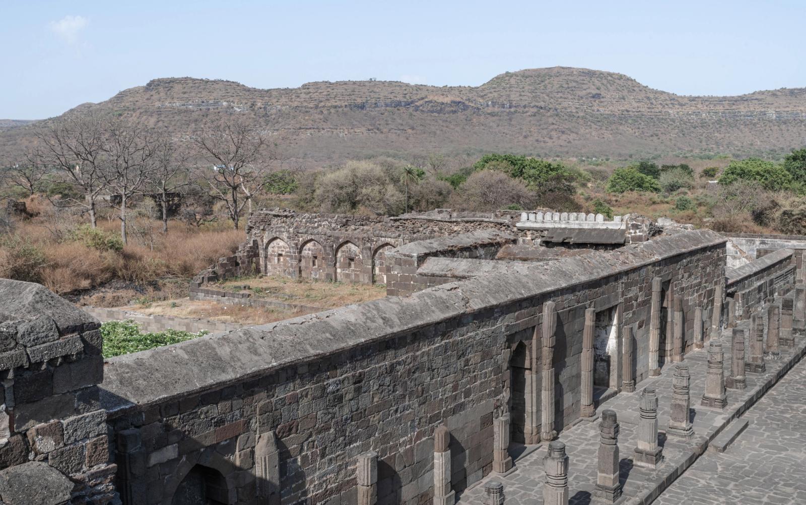 Explore the ancient stone architecture of Daulatabad Fort in Maharashtra, India, with scenic views of the landscape