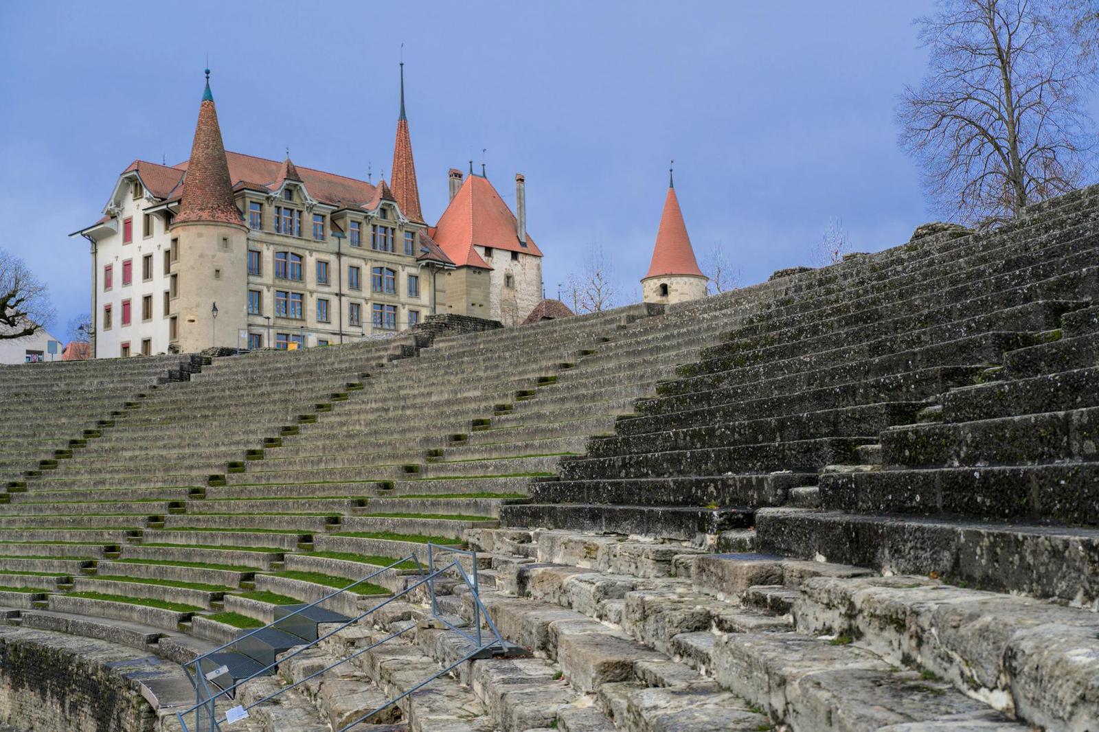 Explore the ancient Avenches amphitheatre with historic Roman architecture in Switzerland