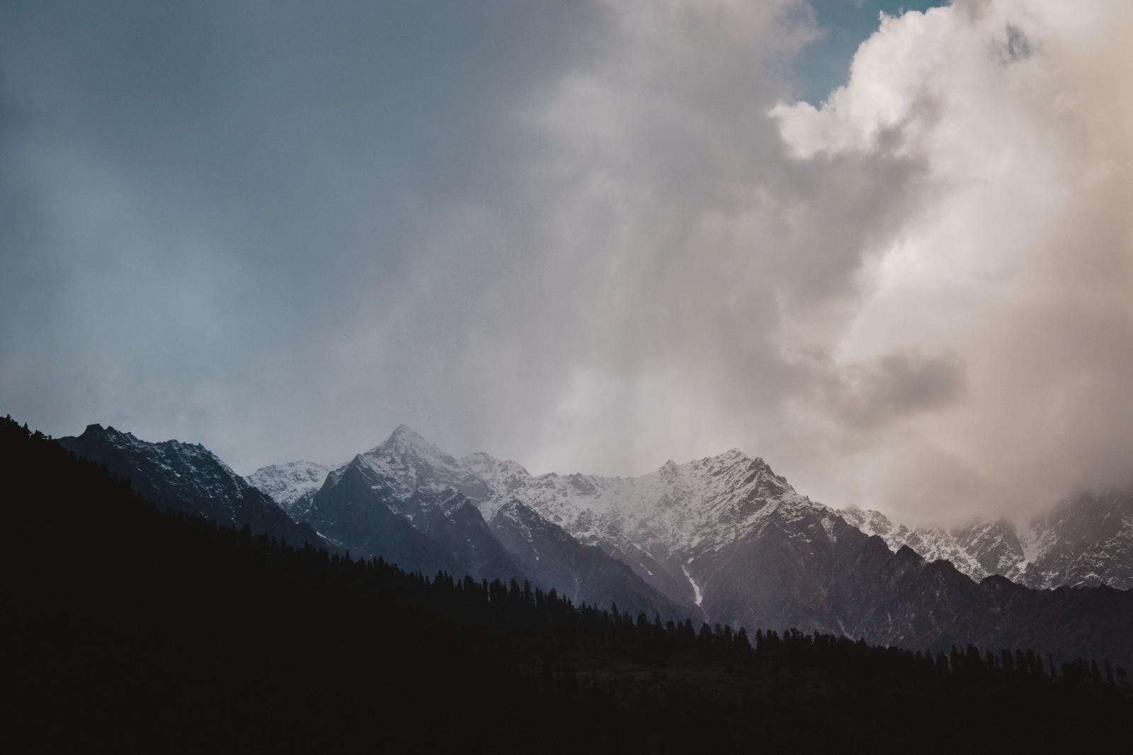 A majestic view of Himalayan mountains with dramatic clouds in Shimla, India