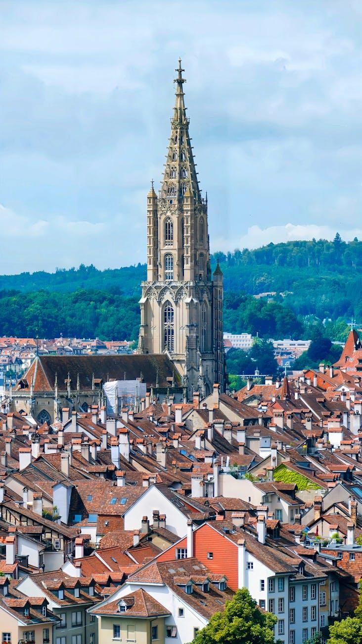A stunning aerial view of Bern Cathedral surrounded by the cityscape in Switzerland