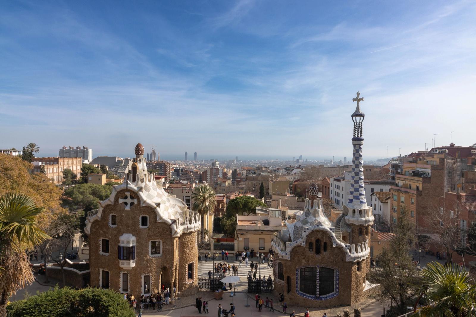 Overlooking Park Güell's unique architecture and cityscape on a sunny day in Barcelona