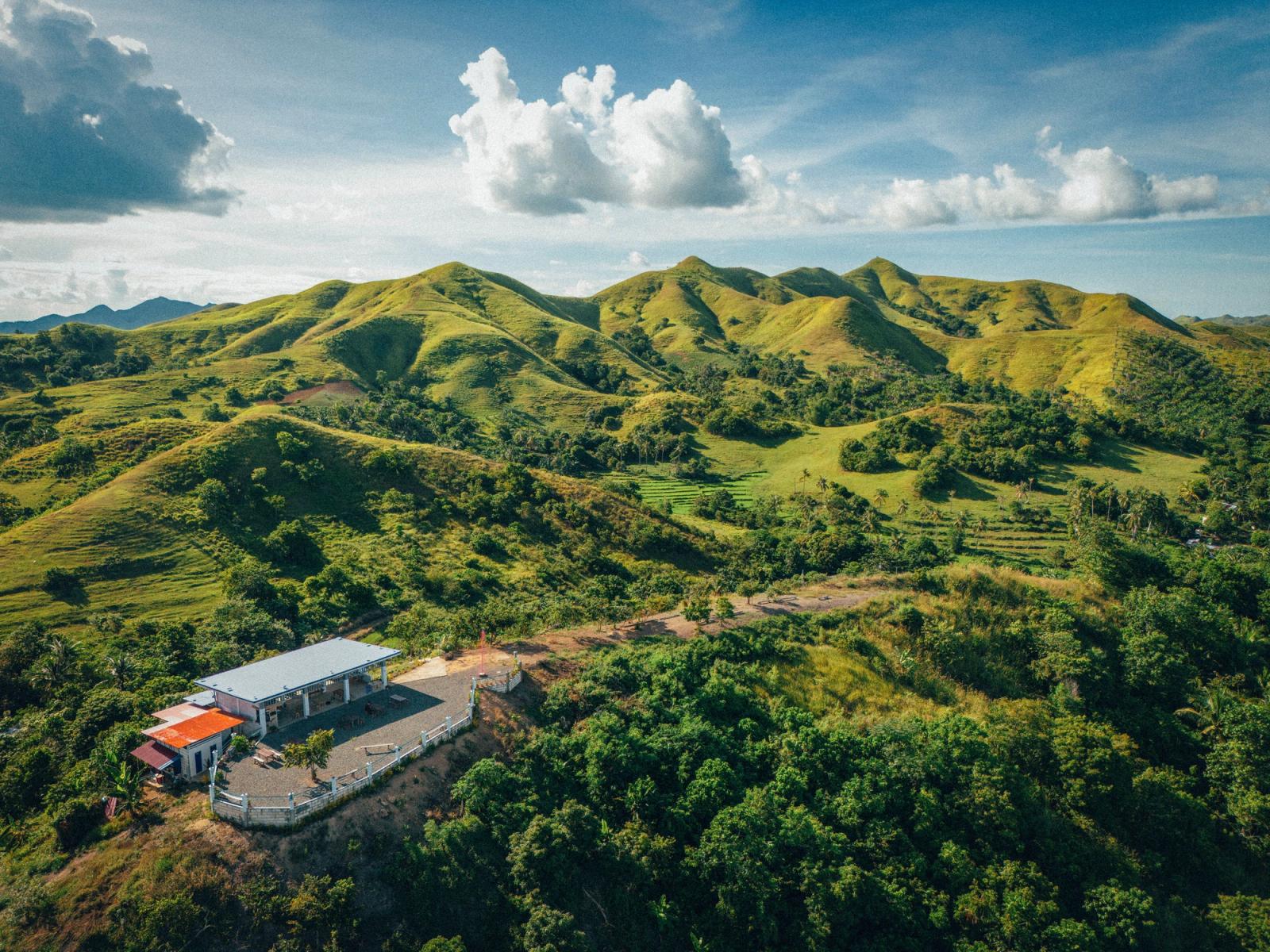 A beautiful aerial view of the lush green hills in Mabini, Central Visayas, Philippines