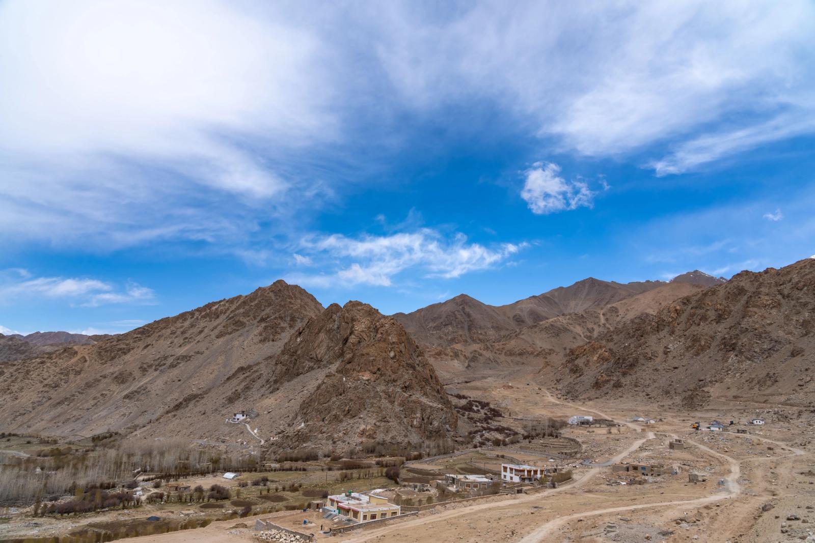 Breathtaking view of arid mountains in Leh, India, under a clear blue sky