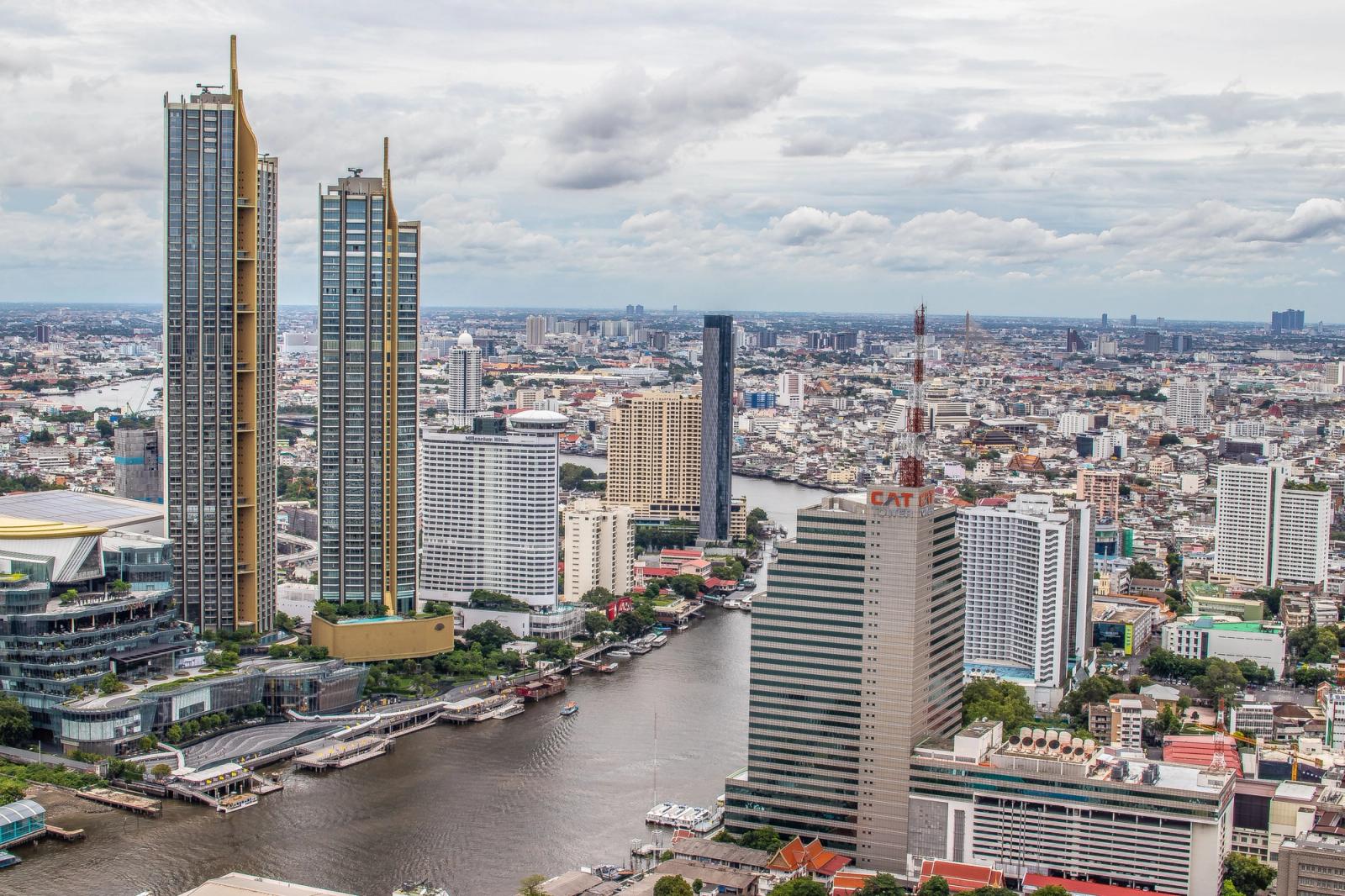 Stunning aerial view of Bangkok showcasing modern skyscrapers along the Chao Phraya River