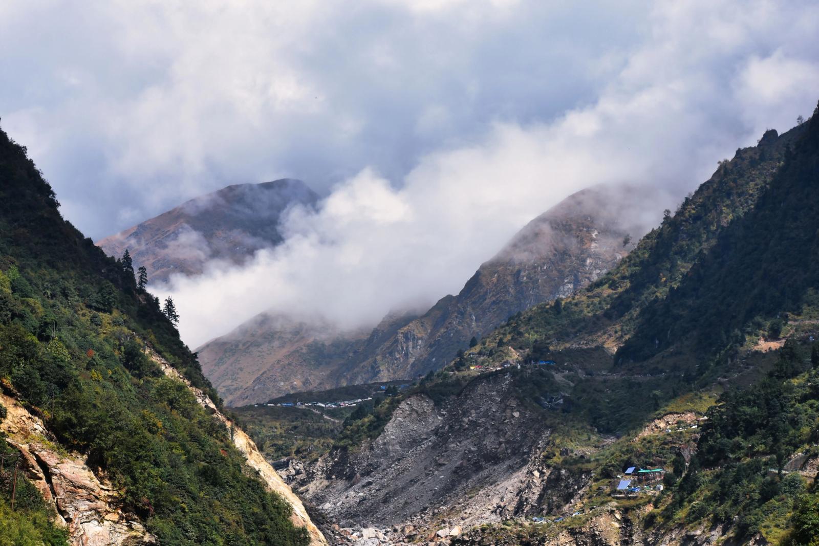 Stunning aerial view of Kedarnath Valley with majestic mountains and swirling clouds