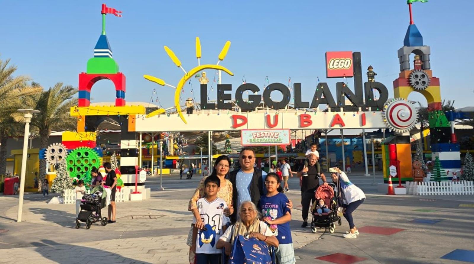 Family posing together in front of LEGOLAND Dubai