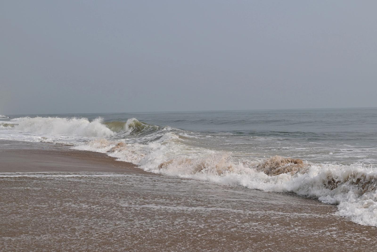 Tranquil ocean waves gently washing the sandy shores of Chennai