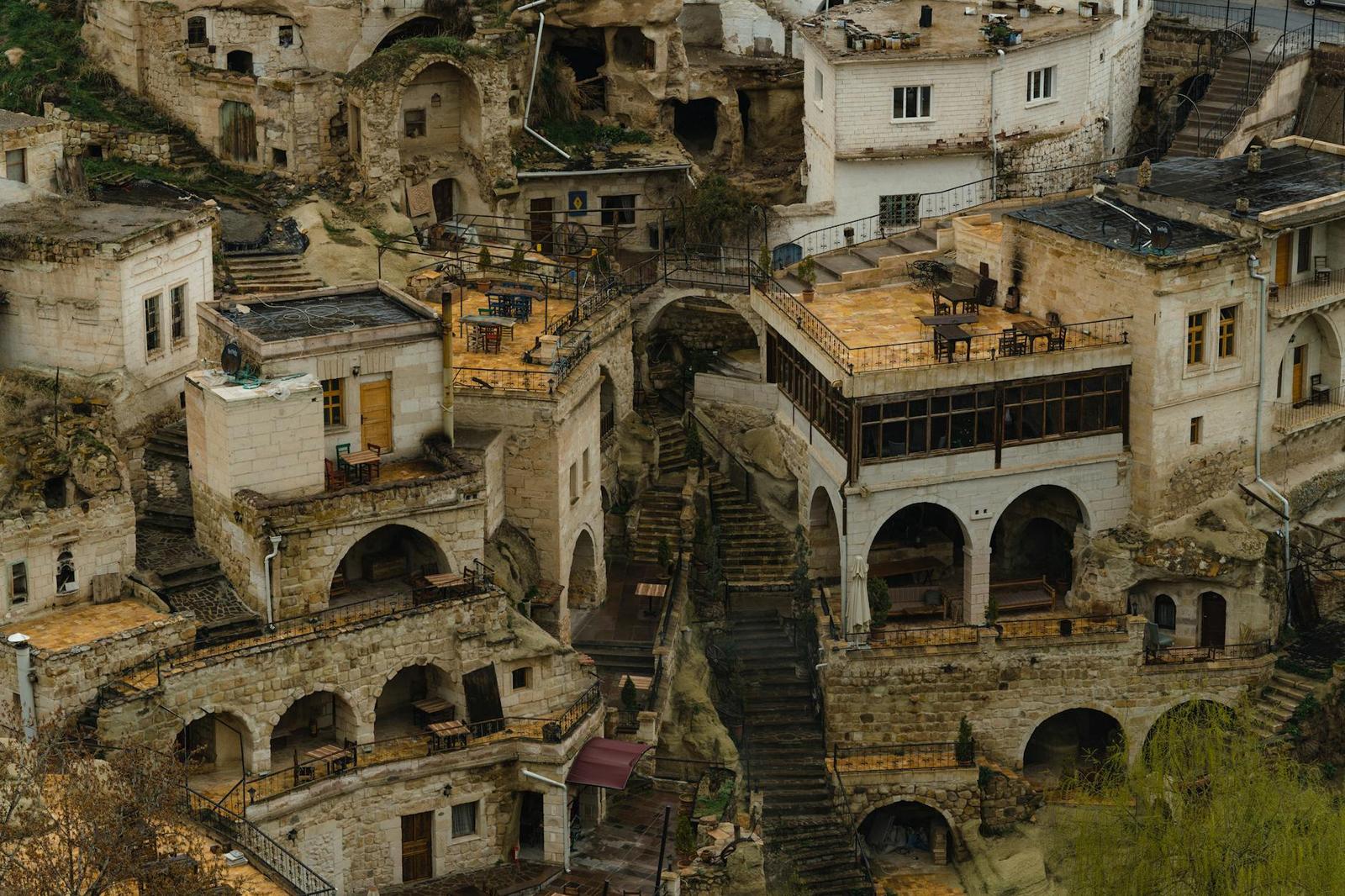 Terraced cave rooms and stone stairways built into a hillside village