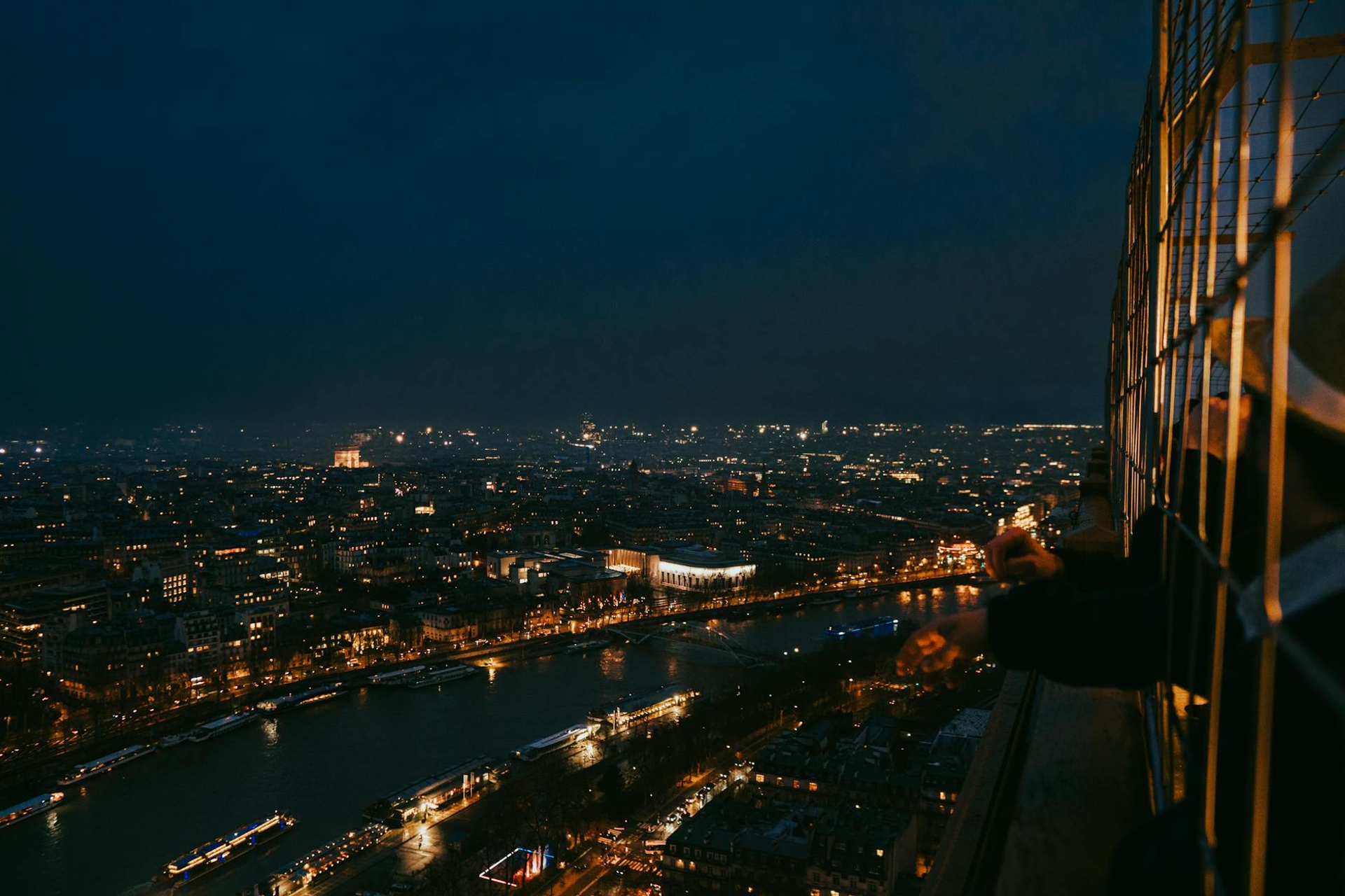 Breathtaking cityscape of Paris at night from the Eiffel Tower's perspective