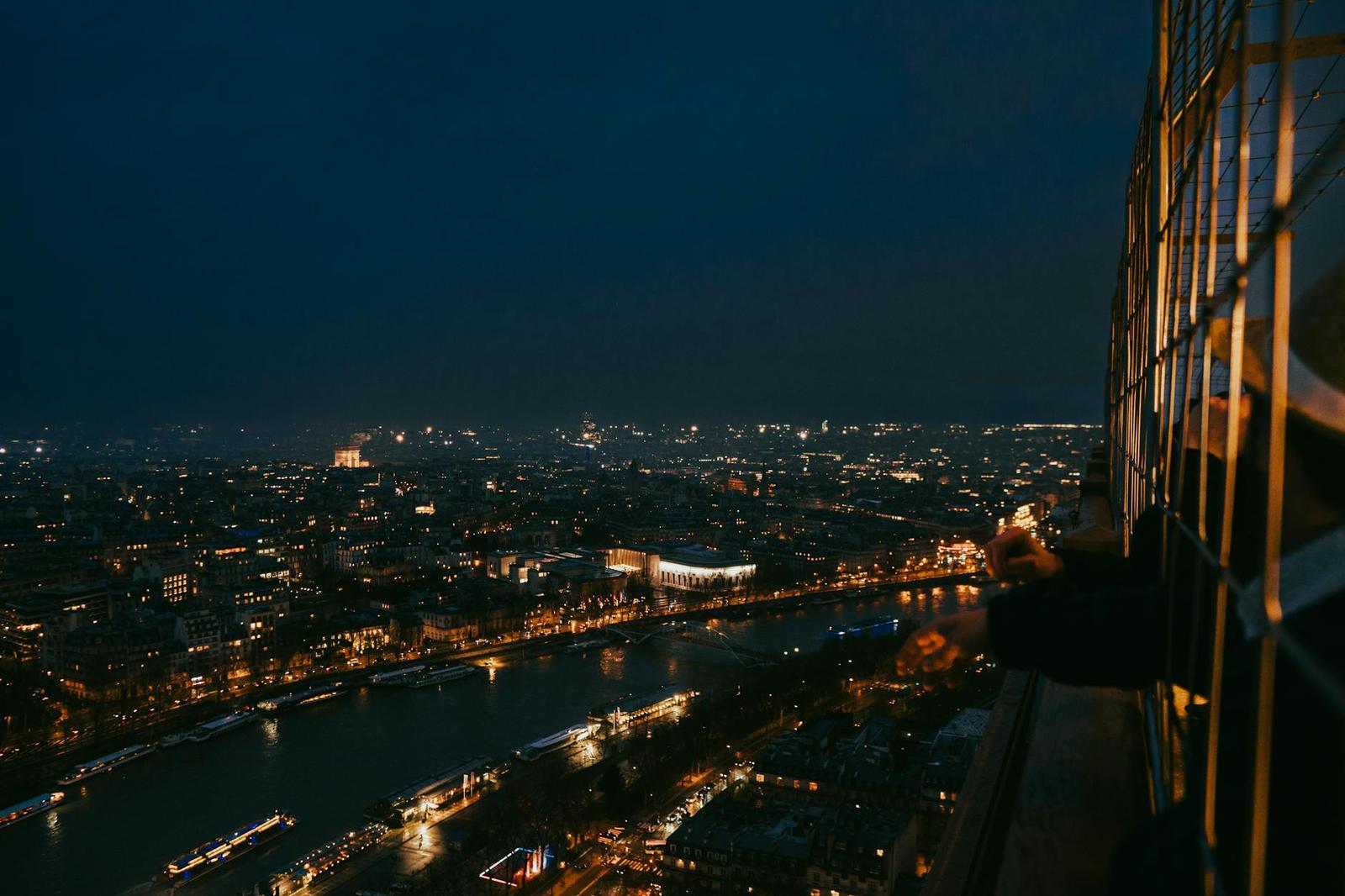 Breathtaking cityscape of Paris at night from the Eiffel Tower's perspective