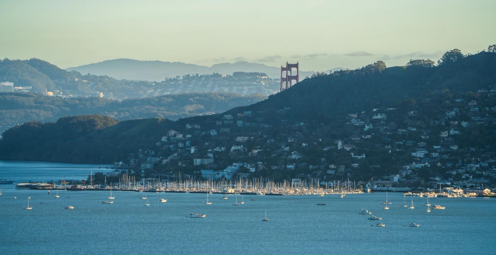 Scenic view of Golden Gate Bridge over San Francisco Bay with yachts in the foreground