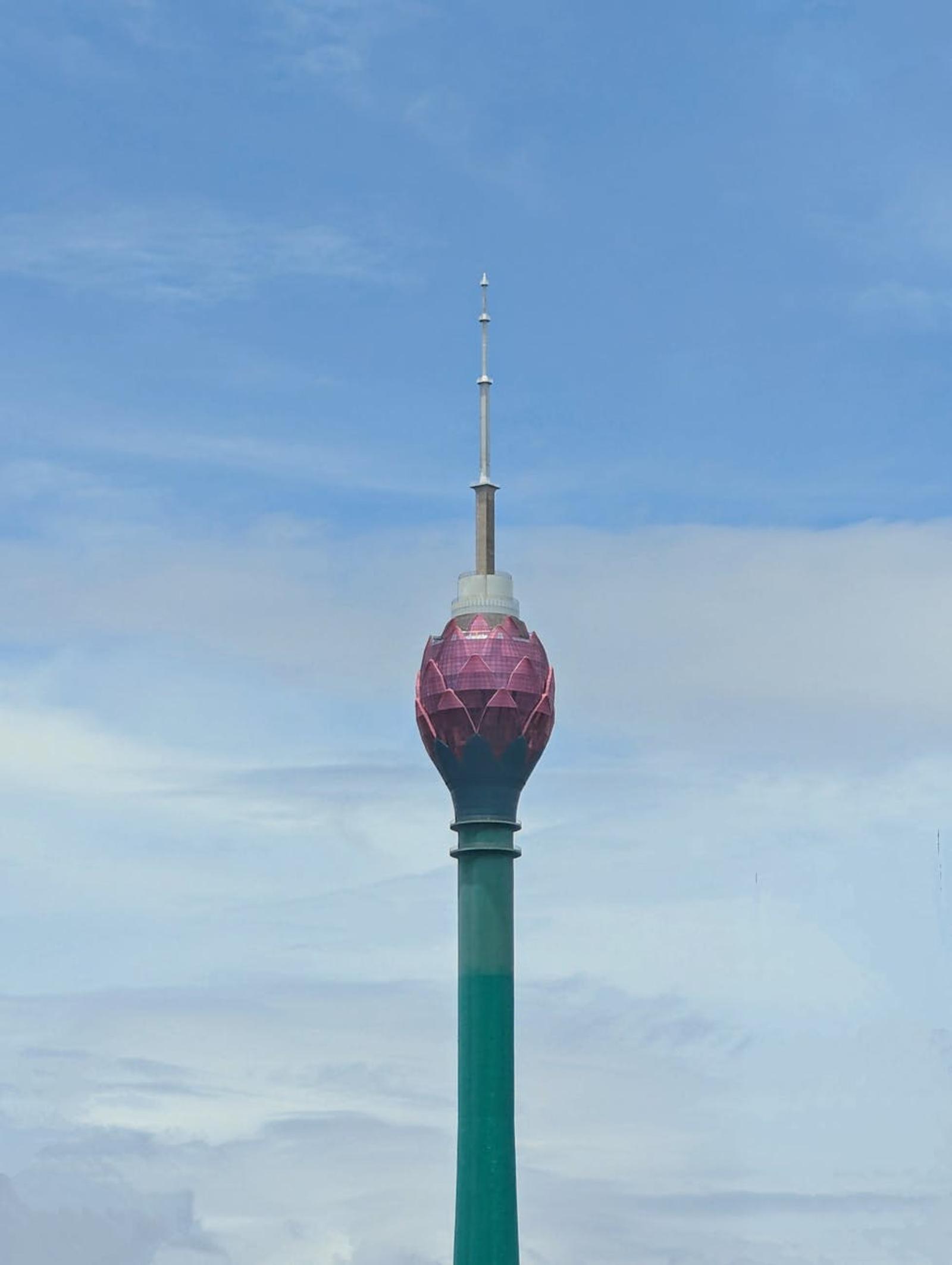 Stunning view of the Lotus Tower in Colombo, Sri Lanka with a bright blue sky in the background
