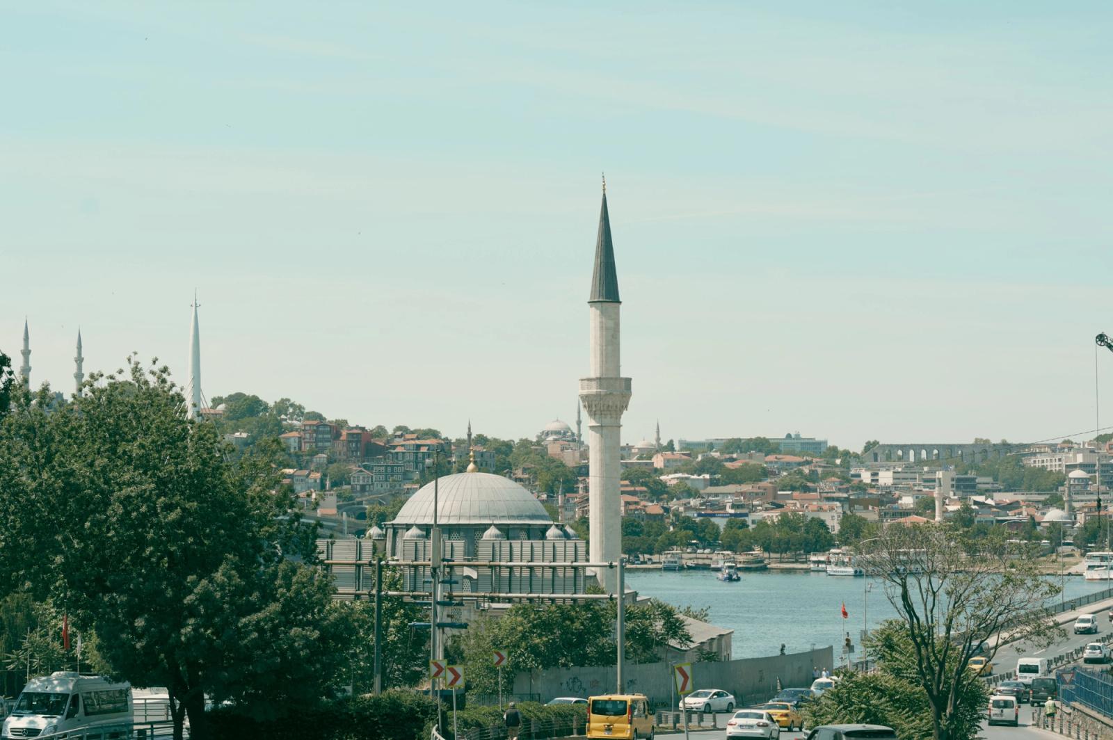A serene view of Istanbul's skyline featuring a mosque and the Bosphorus on a sunny day