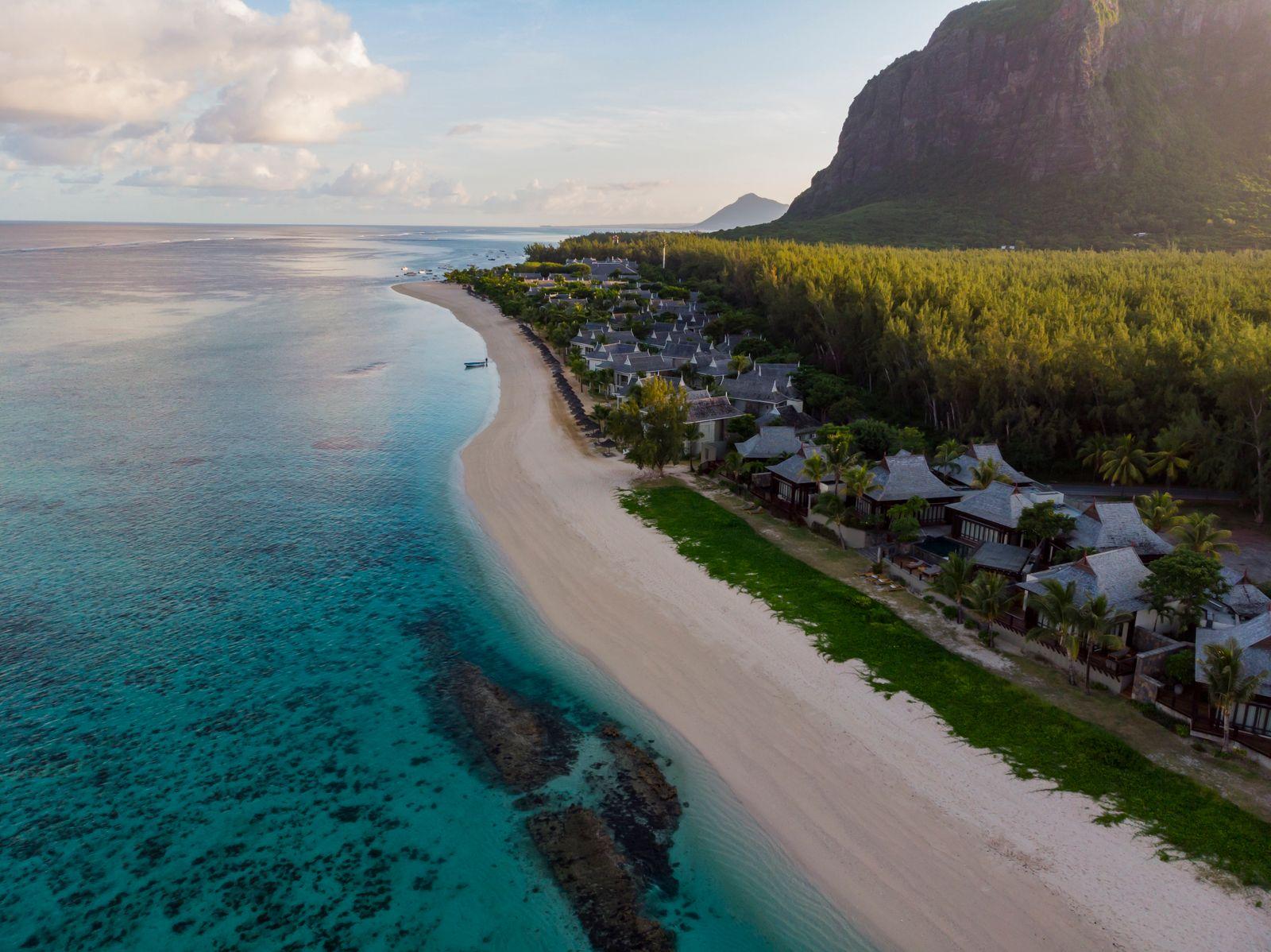 A beachfront resort on the Mauritius lagoon beneath the mountain