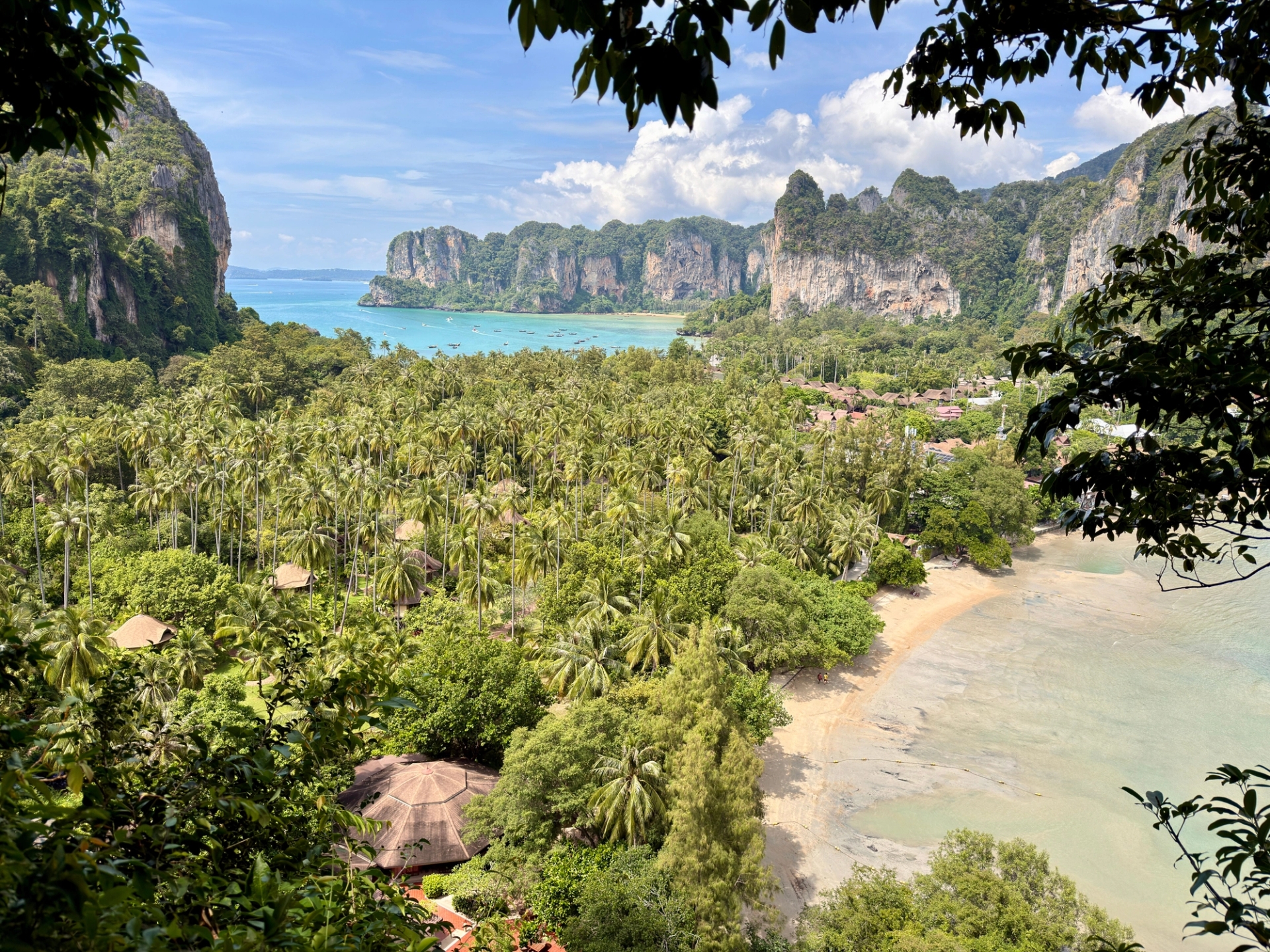 Breathtaking view of tropical beach with lush greenery and cliffs in Krabi, Thailand
