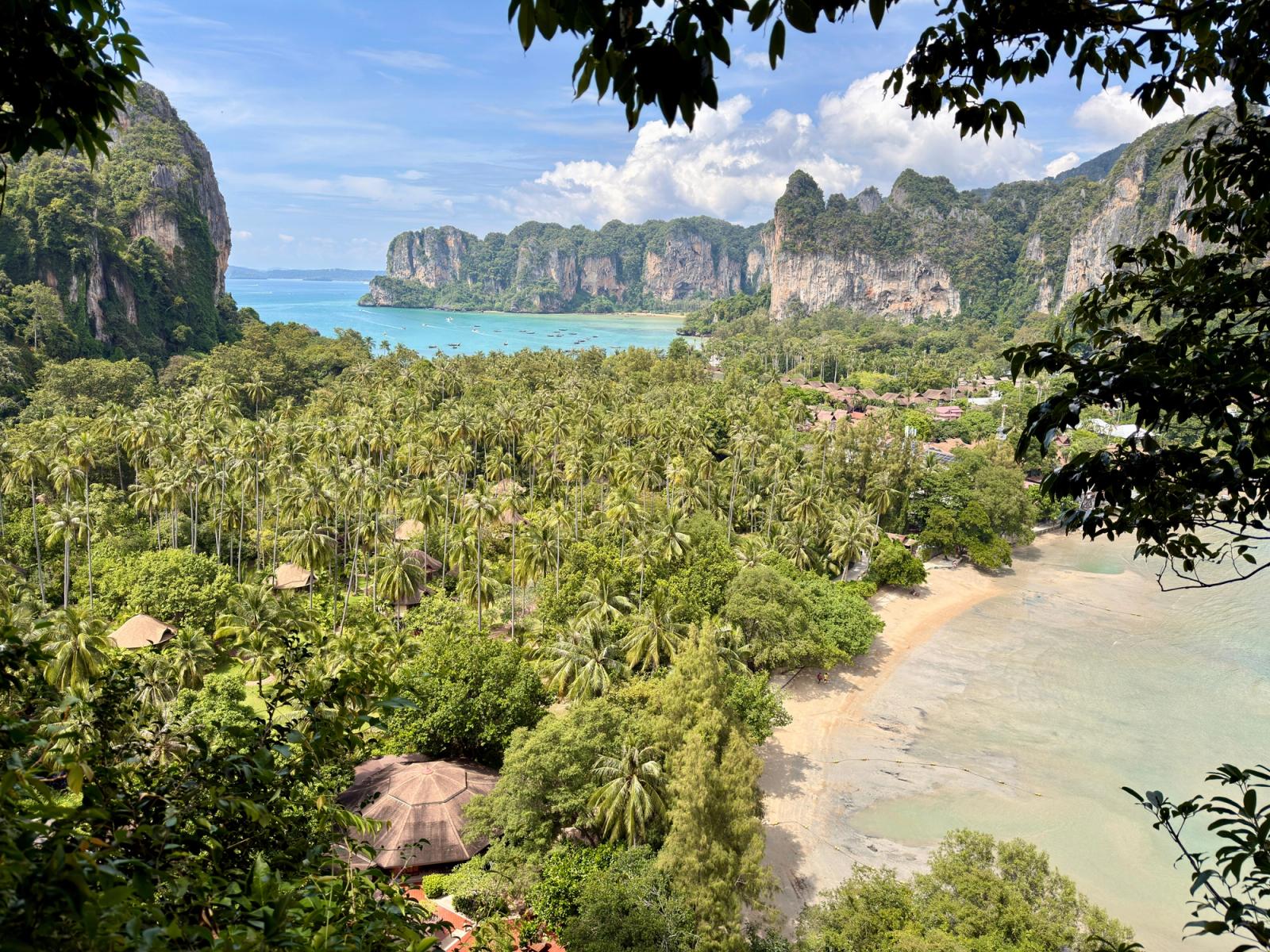 Breathtaking view of tropical beach with lush greenery and cliffs in Krabi, Thailand